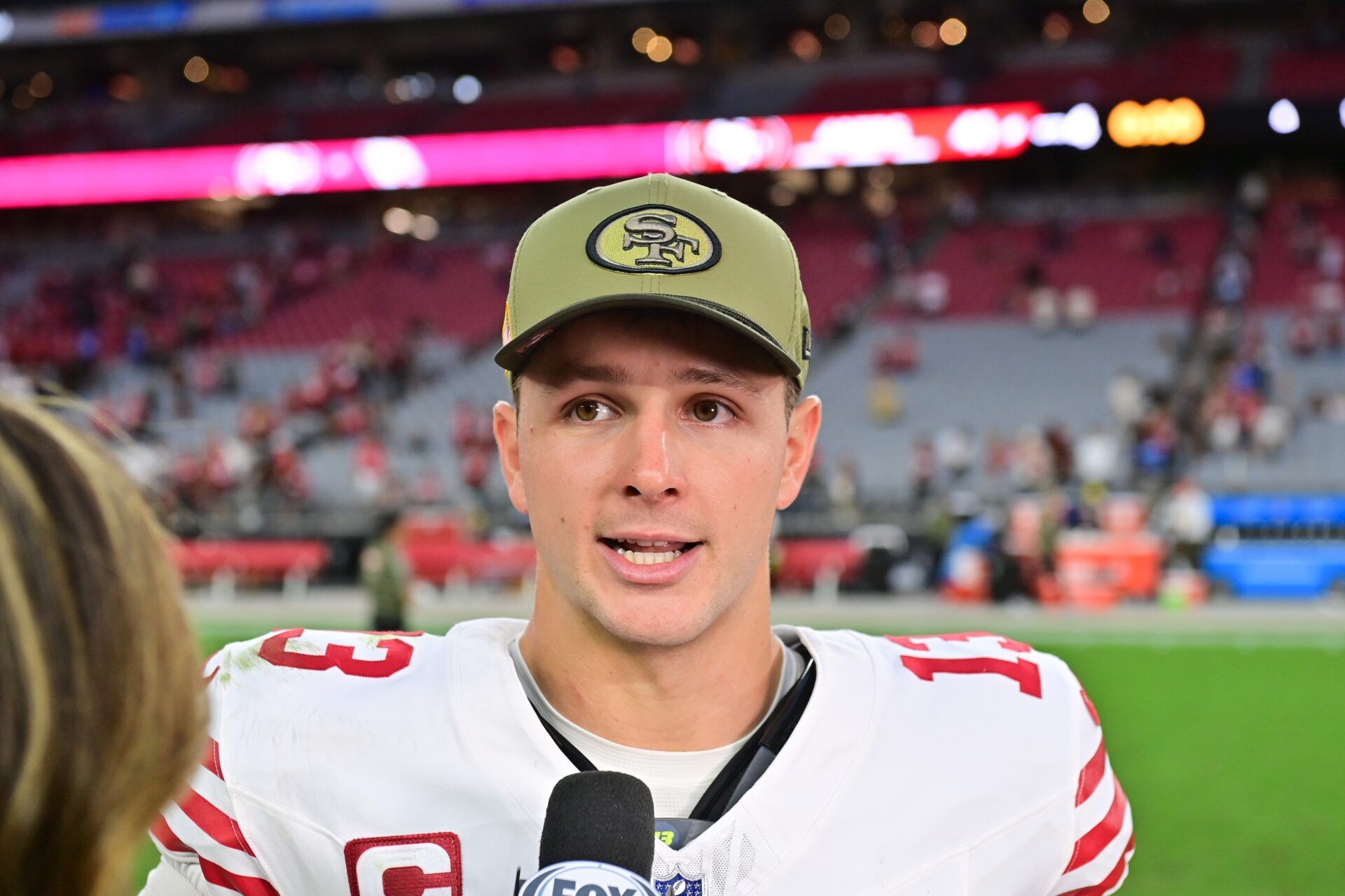 San Francisco 49ers quarterback Brock Purdy (13) is interviewed after the game against the Arizona Cardinals at State Farm Stadium.