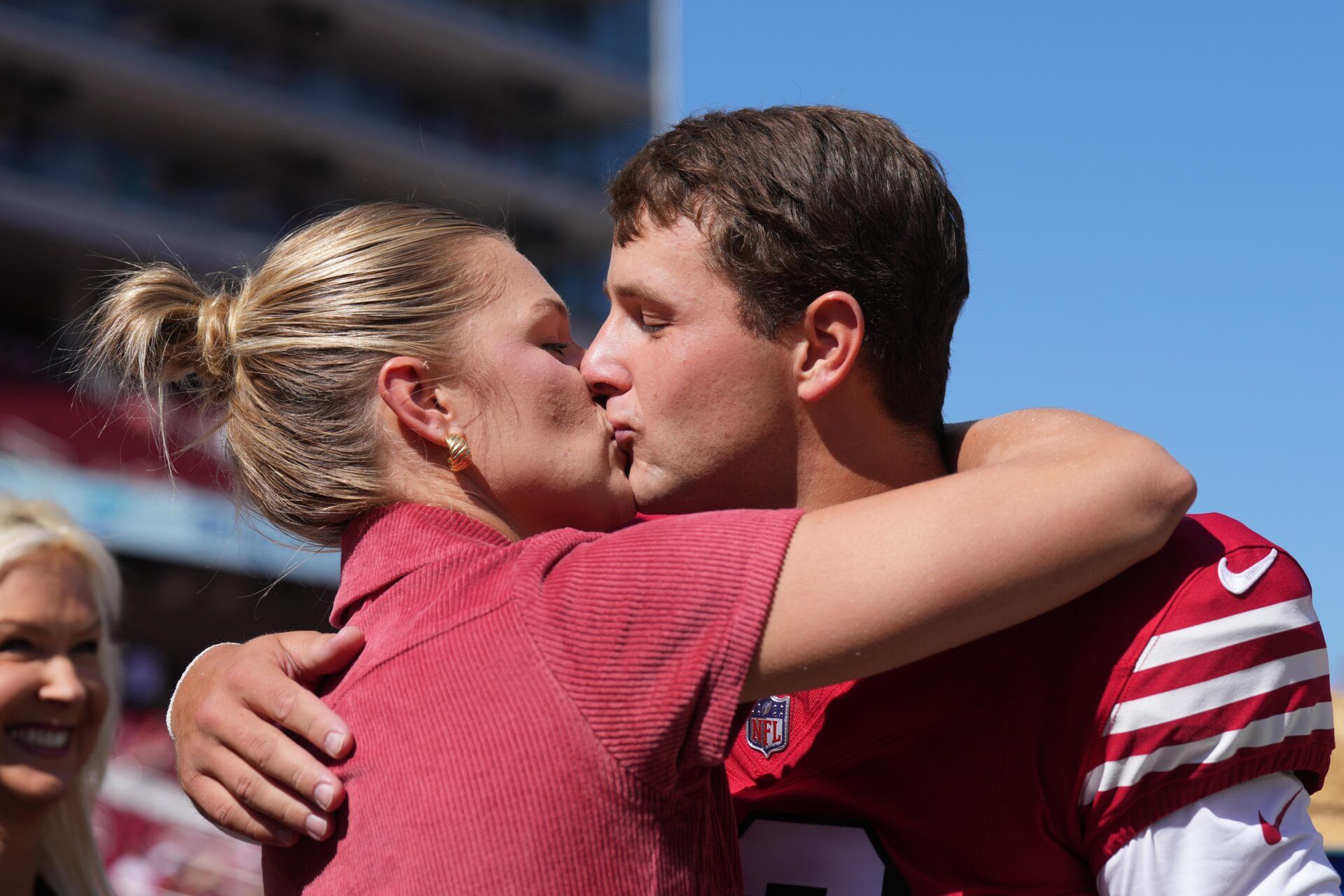 San Francisco 49ers quarterback Brock Purdy (right) kisses his wife Jenna Brandt (left) before the game against the Arizona Cardinals at Levi's Stadium.