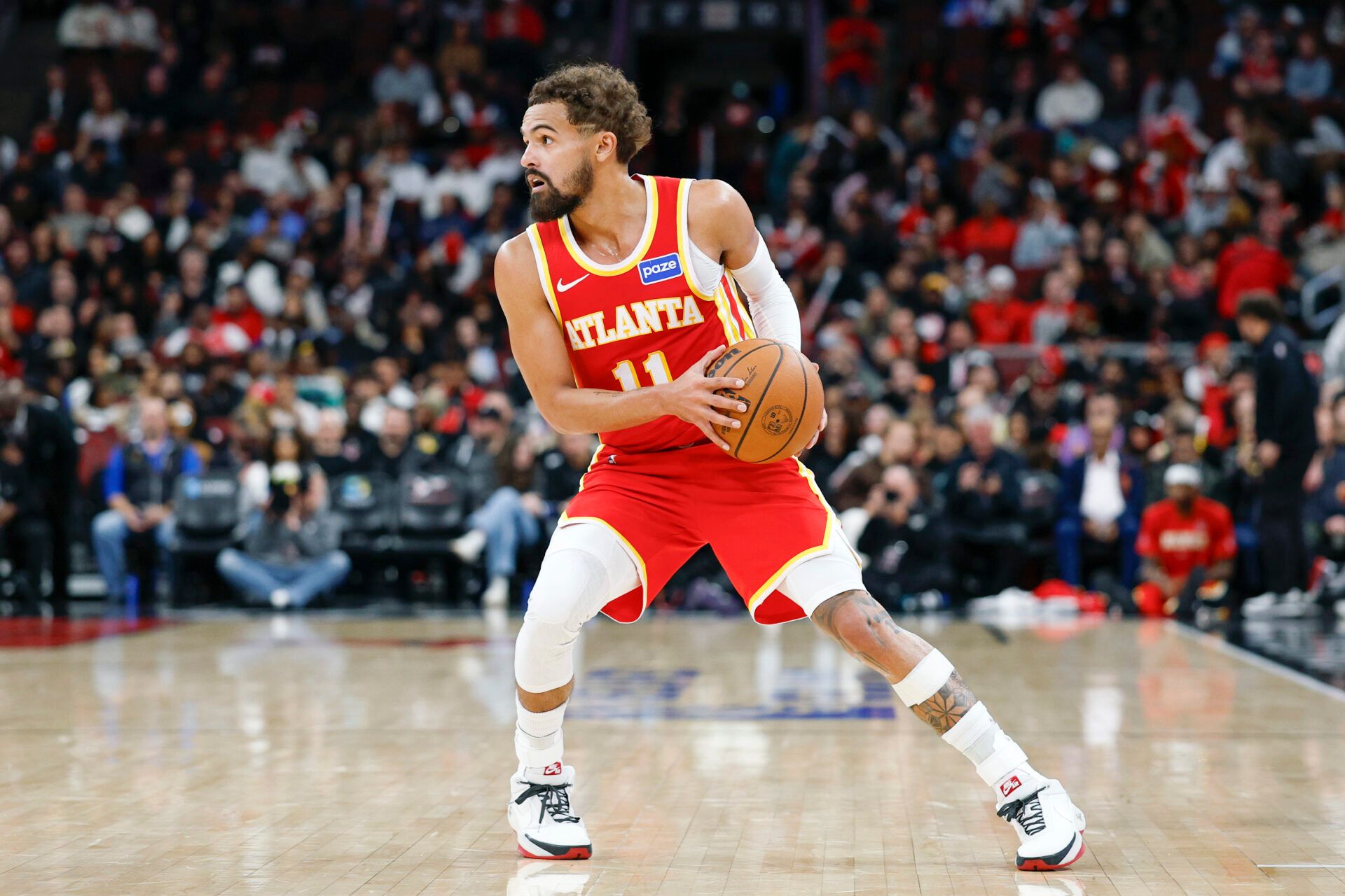 Atlanta Hawks guard Trae Young (11) looks to pass the ball against the Chicago Bulls during the second half at United Center.