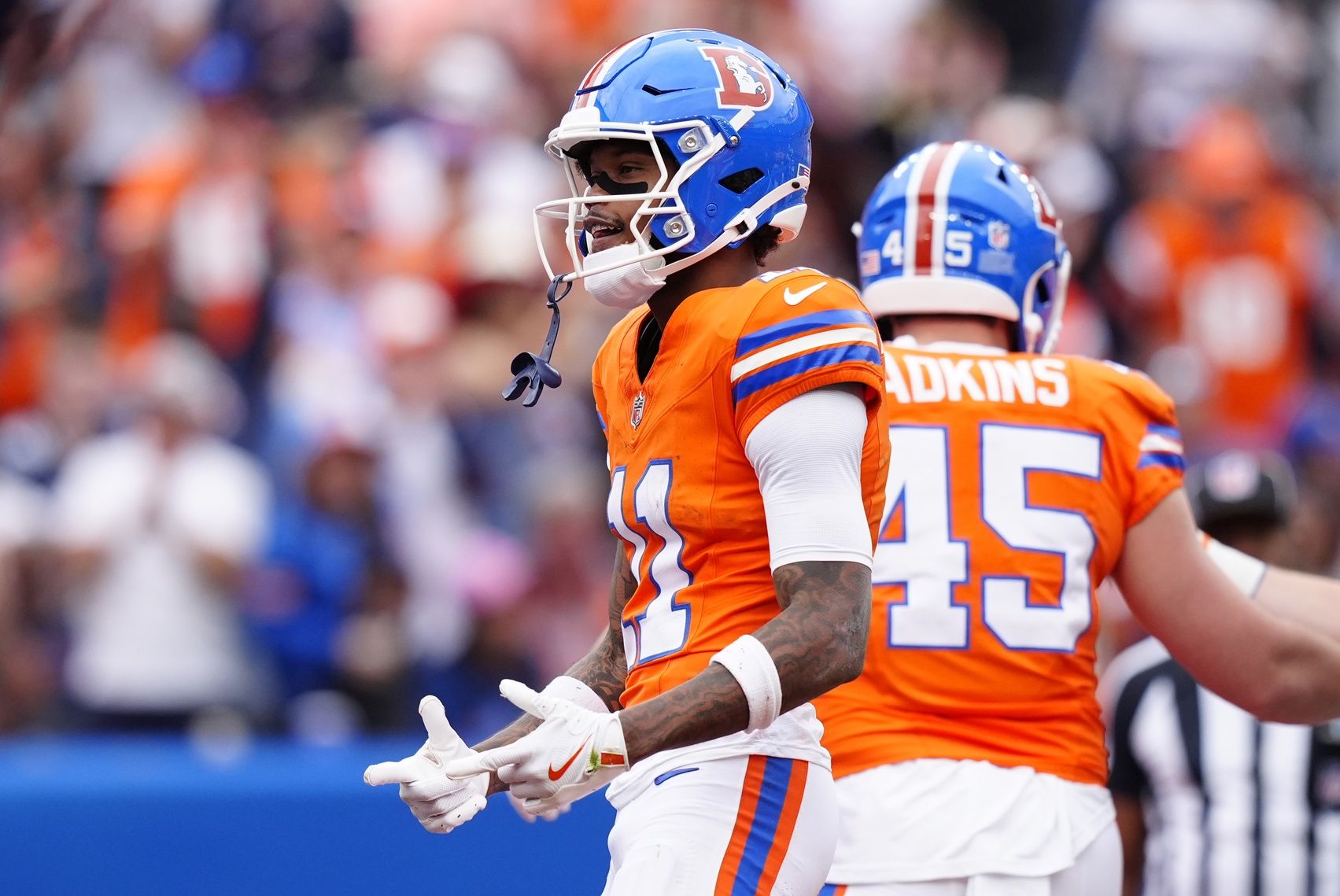 Denver Broncos wide receiver Troy Franklin (11) celebrates after scoring a touchdown against the Dallas Cowboys in the second quarter at Empower Field at Mile High.