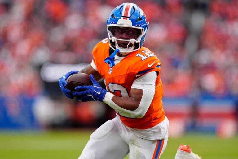 Denver Broncos running back RJ Harvey (12) runs against the Dallas Cowboys in the second half at Empower Field at Mile High.