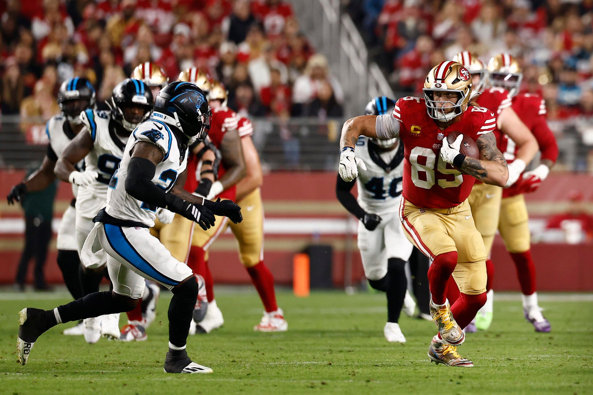 San Francisco 49ers tight end George Kittle (85) makes a catch against the Carolina Panthers during the first half at Levi's Stadium.