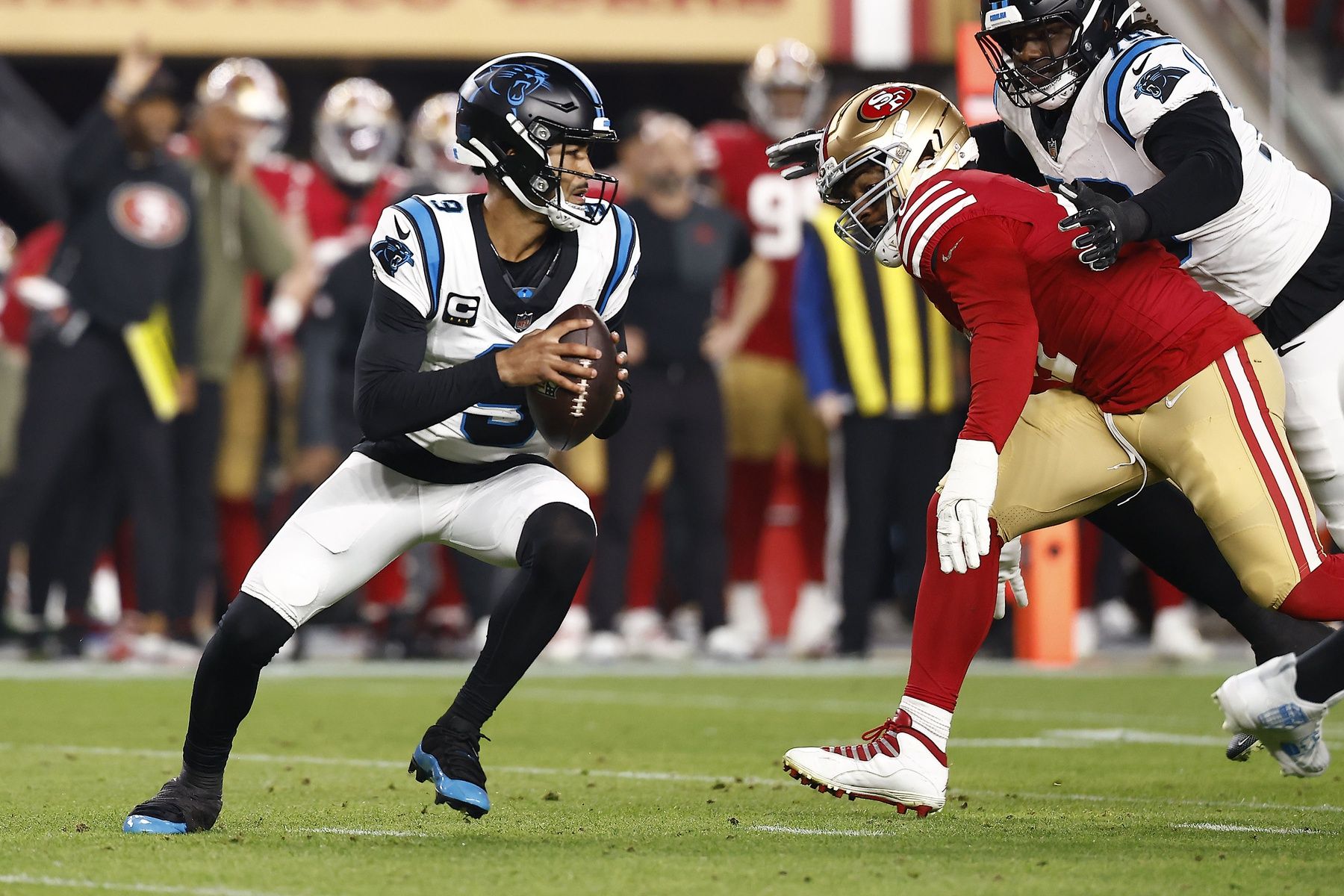 Carolina Panthers quarterback Bryce Young (9) drops back to pass against the San Francisco 49ers during the first half at Levi's Stadium.