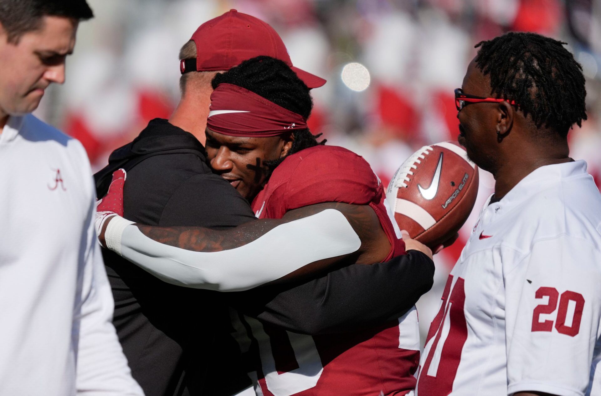 Alabama head coach Kalen DeBoer hugs Alabama running back Dre Washington (20) as he congratulates seniors on Senior Day at Saban Field at Bryant-Denny Stadium.