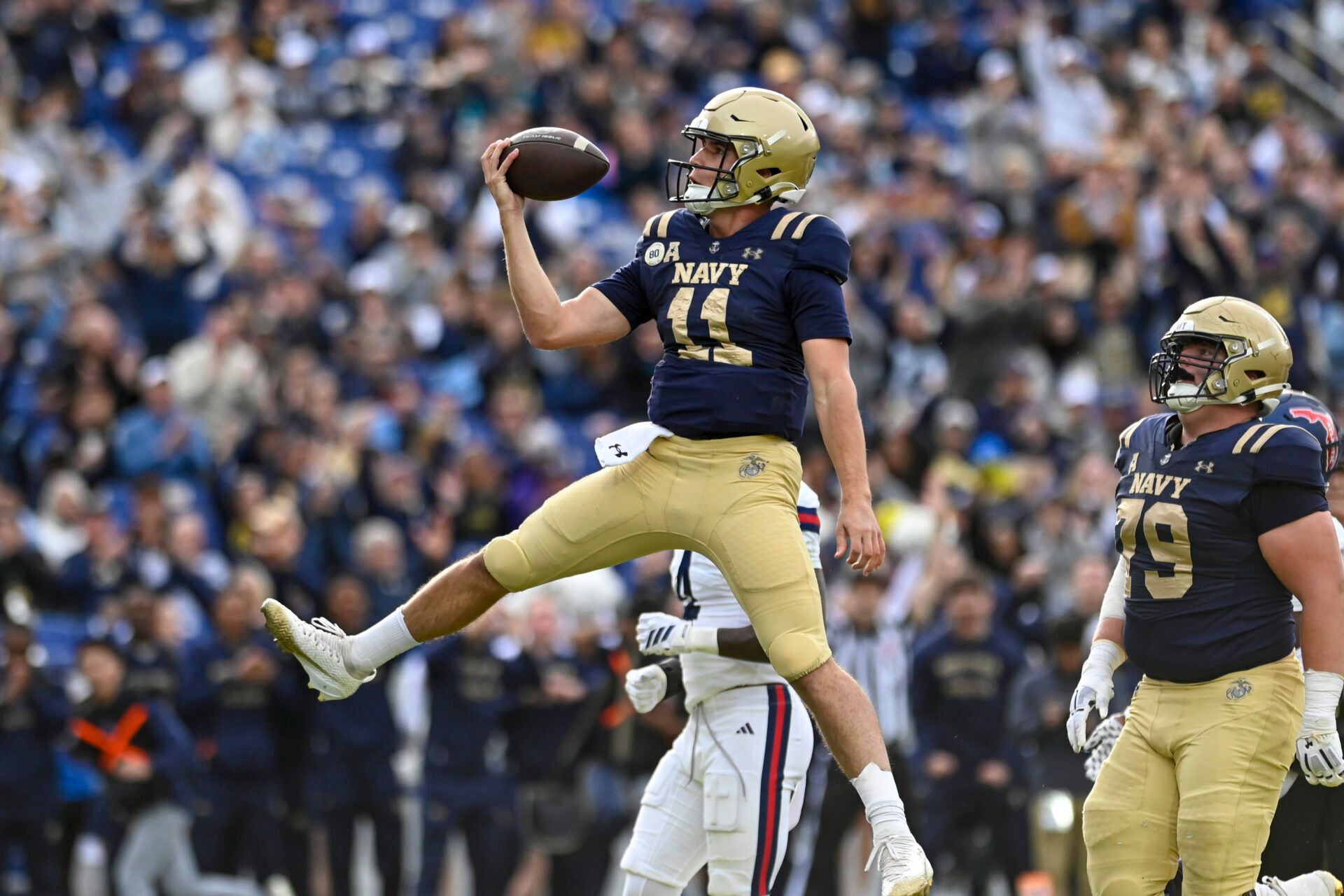 Navy Midshipmen quarterback Blake Horvath (11) reacts after scoring a second quarter touchdown against the Florida Atlantic Owls at Navy-Marine Corps Memorial Stadium.