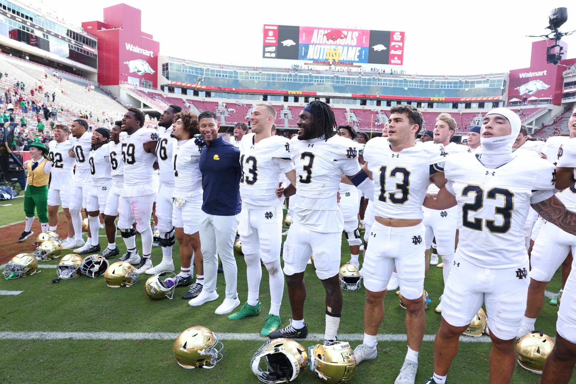 Notre Dame Fighting Irish head coach Marcus Freeman leads the team in celebration after the game against the Arkansas Razorbacks at Donald W. Reynolds Razorback Stadium. Notre Dame won 56-13.