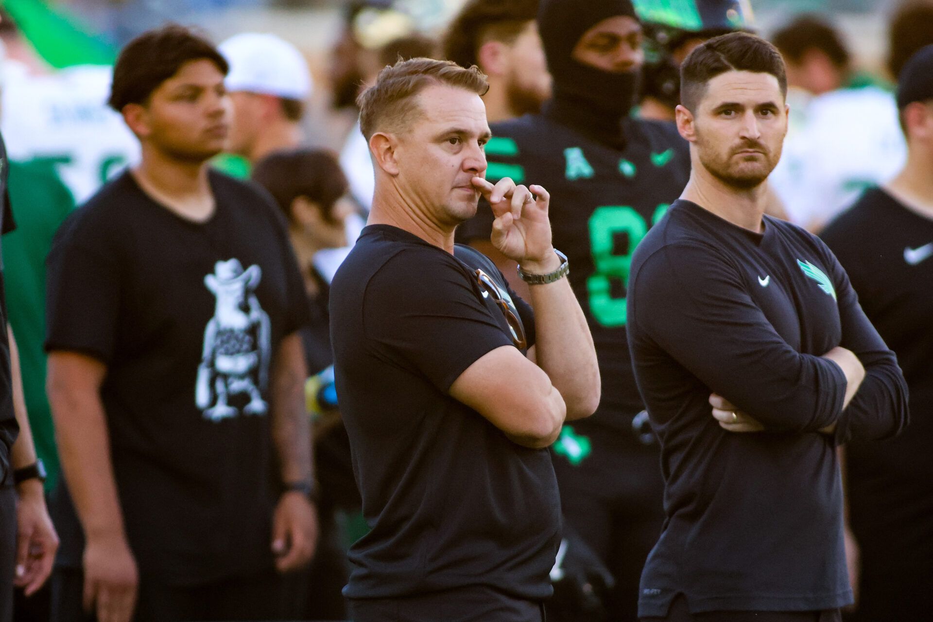 North Texas Mean Green head coach Eric Morris watches his team warm up prior to a game against the South Florida Bulls at DATCU Stadium.