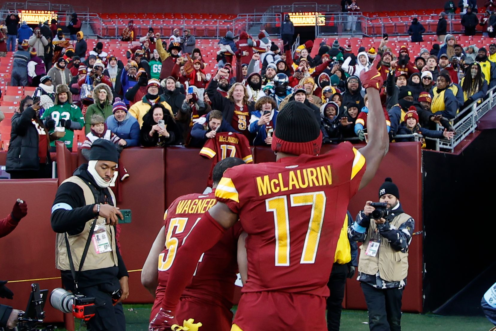 Washington Commanders wide receiver Terry McLaurin (17) celebrates while leaving the field with Commanders linebacker Bobby Wagner (54) after their game against the Philadelphia Eagles at Northwest Stadium.