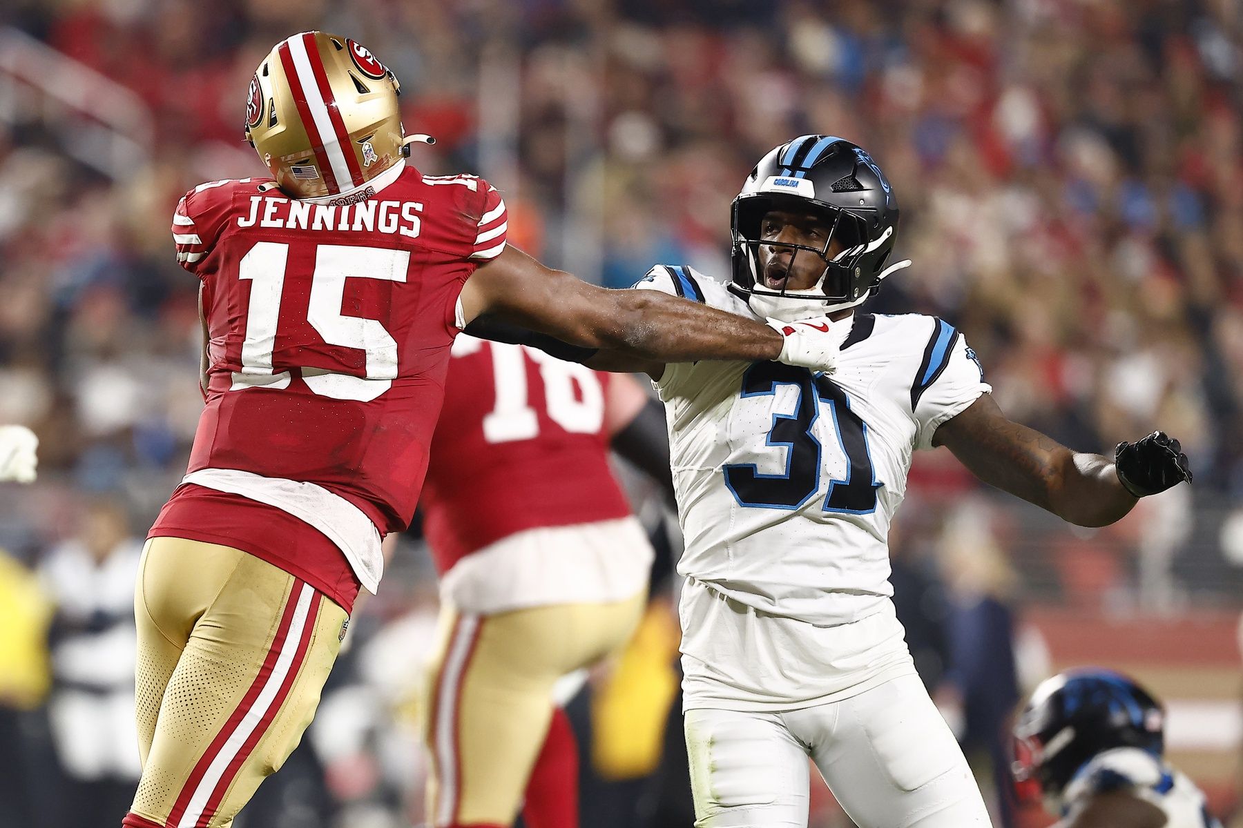 San Francisco 49ers wide receiver Jauan Jennings (15) and Carolina Panthers cornerback Corey Thornton (31) shove each other during the second half at Levi's Stadium.