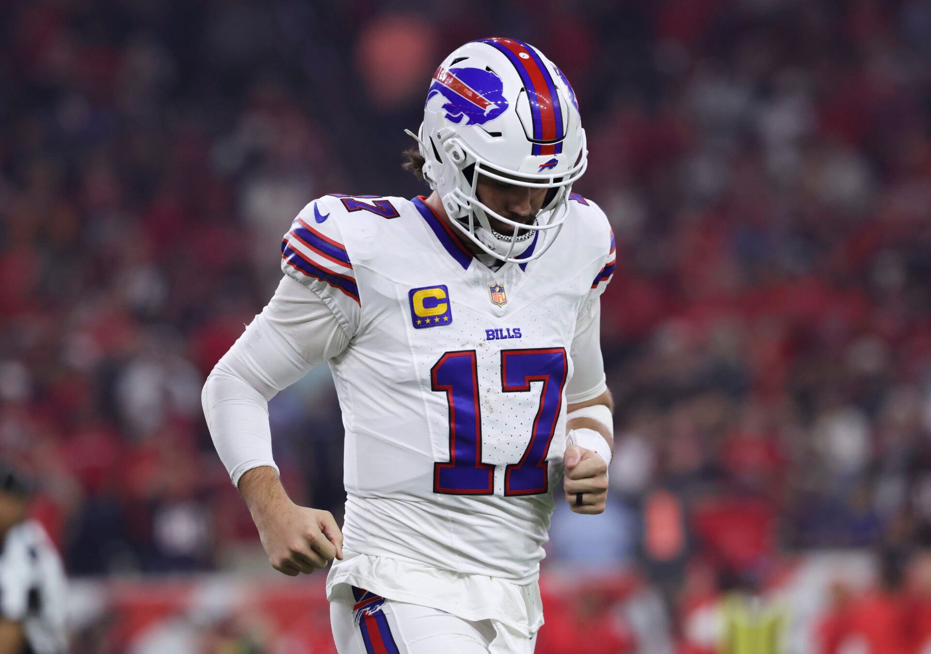 Buffalo Bills quarterback Josh Allen (17) walks off the field after a play during the game against the Houston Texans at NRG Stadium.
