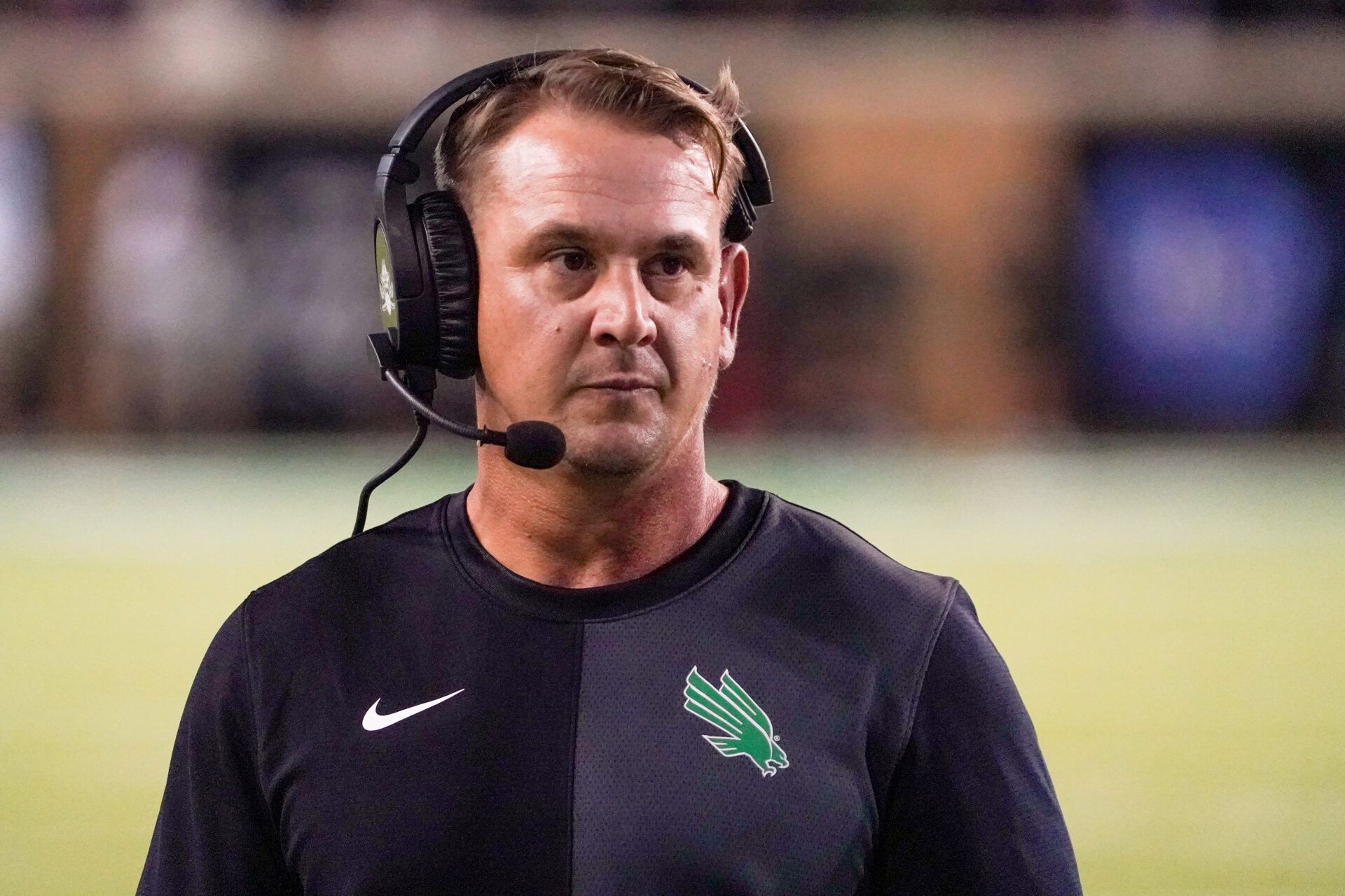 North Texas Mean Green head coach Eric Morris stands on the sidelines against the South Florida Bulls during the second half of a game at DATCU Stadium.