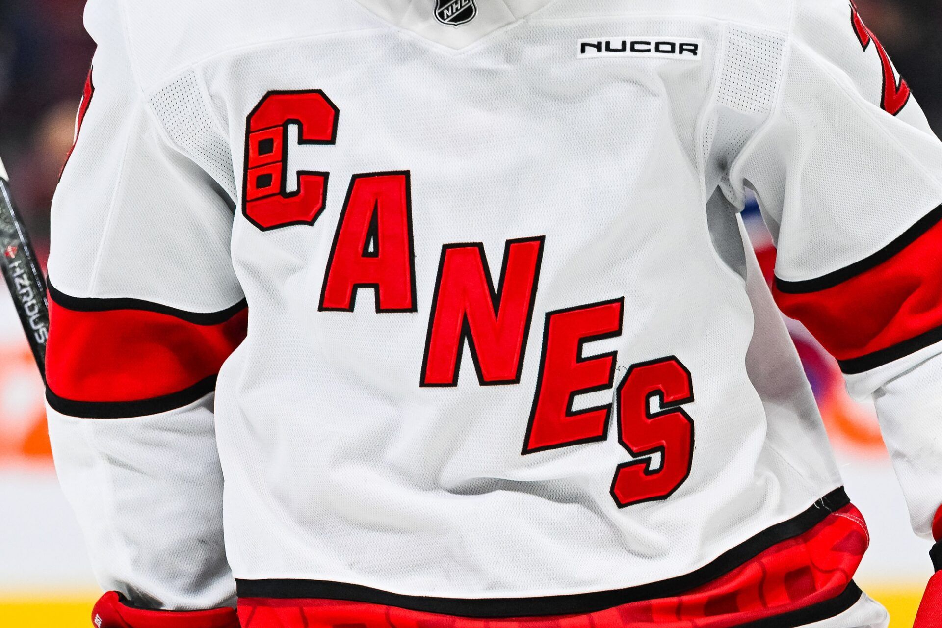 View of a Carolina Hurricanes logo on a jersey worn by a member of the team in the second period at Bell Centre.