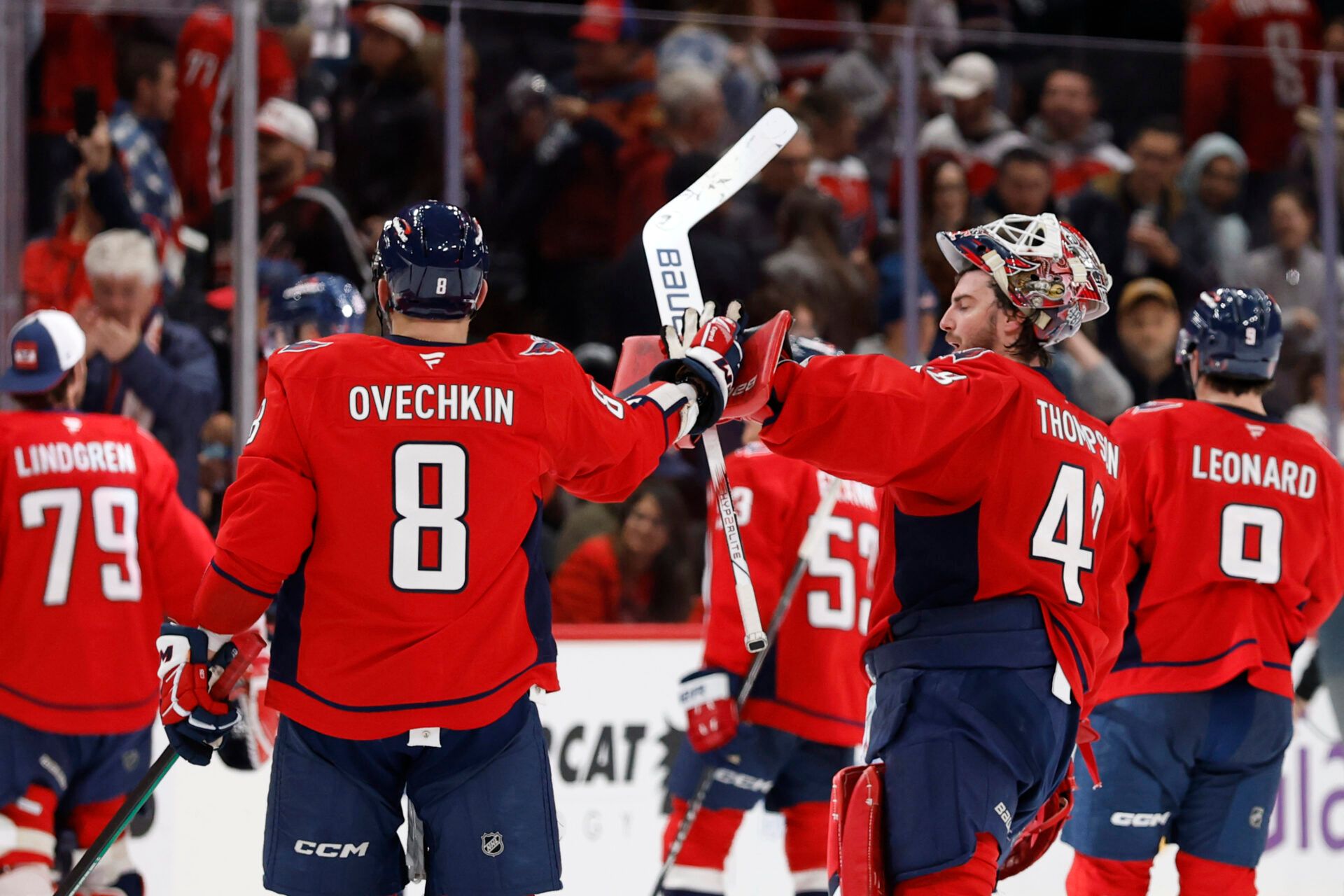 Washington Capitals left wing Alex Ovechkin (8) celebrates with Capitals goaltender Logan Thompson (48) after their game against the Columbus Blue Jackets at Capital One Arena.