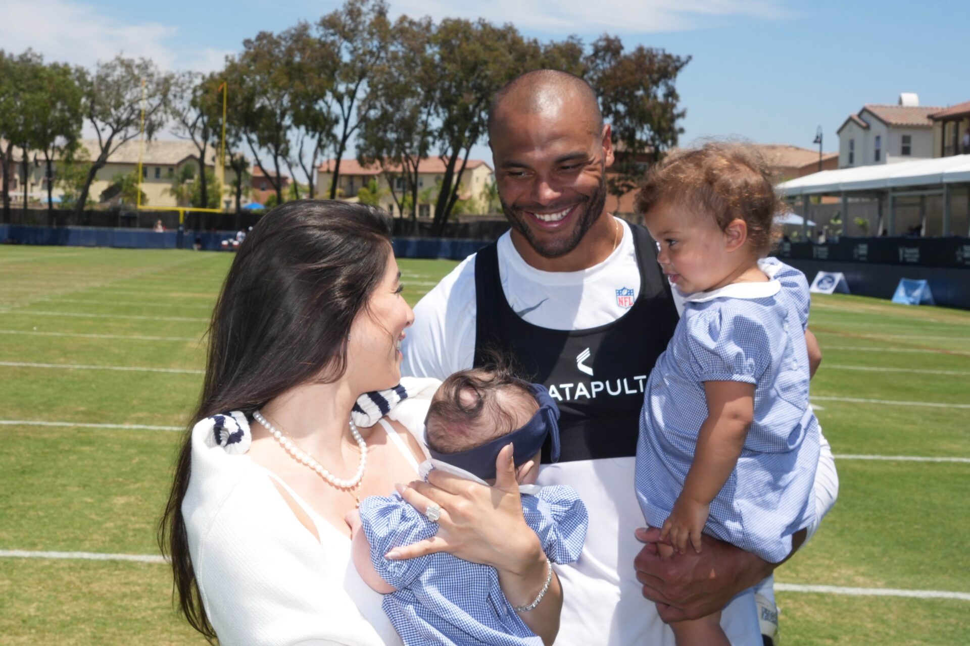 Dallas Cowboys quarterback Dak Prescott visits fiancee Sarah Jane Ramos and daughters MJ Rose Prescott and Aurora Prescott at training camp at the River Ridge Fields.