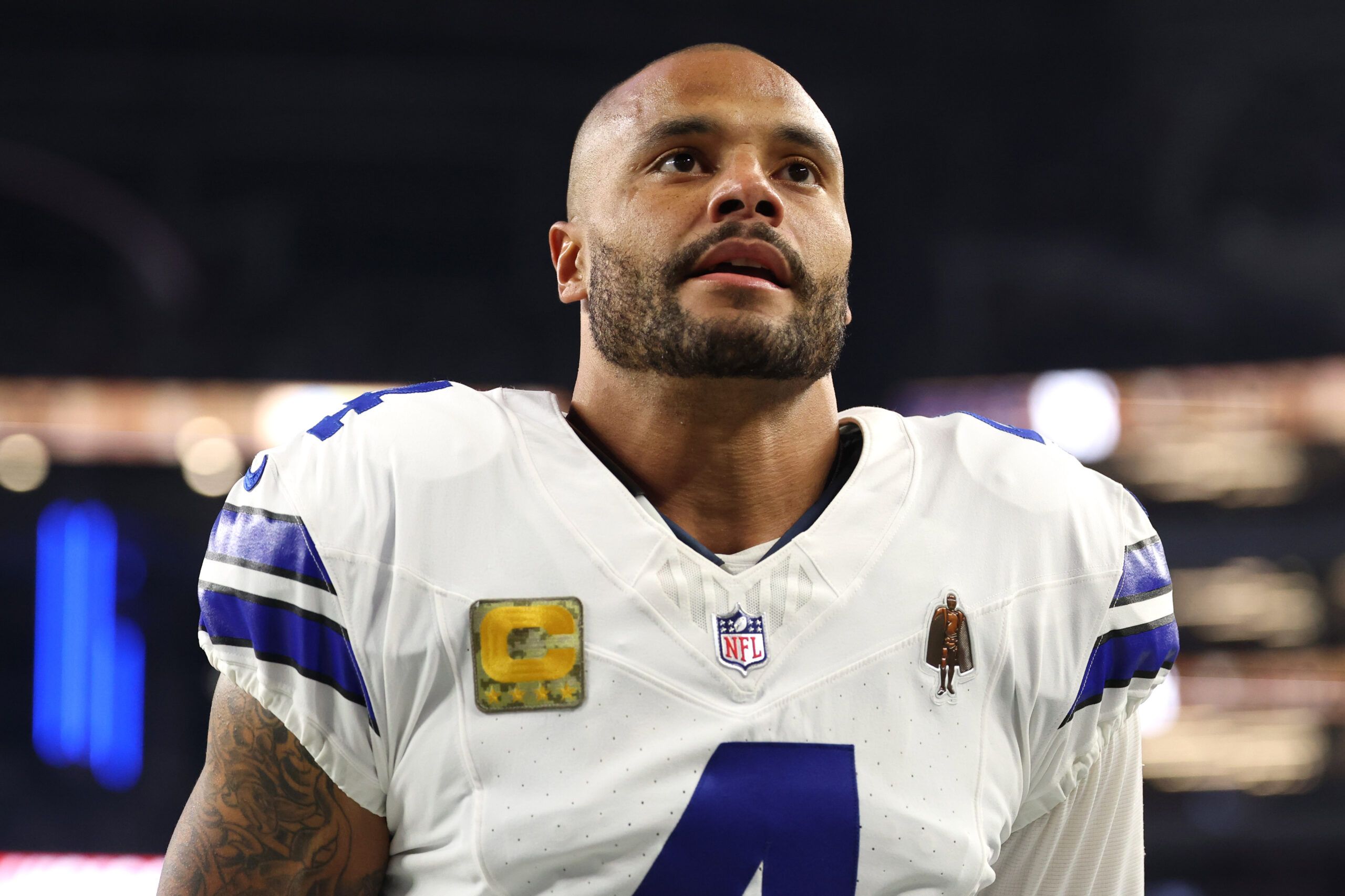 Dallas Cowboys quarterback Dak Prescott (4) looks on before the game against the Arizona Cardinals at AT&T Stadium.