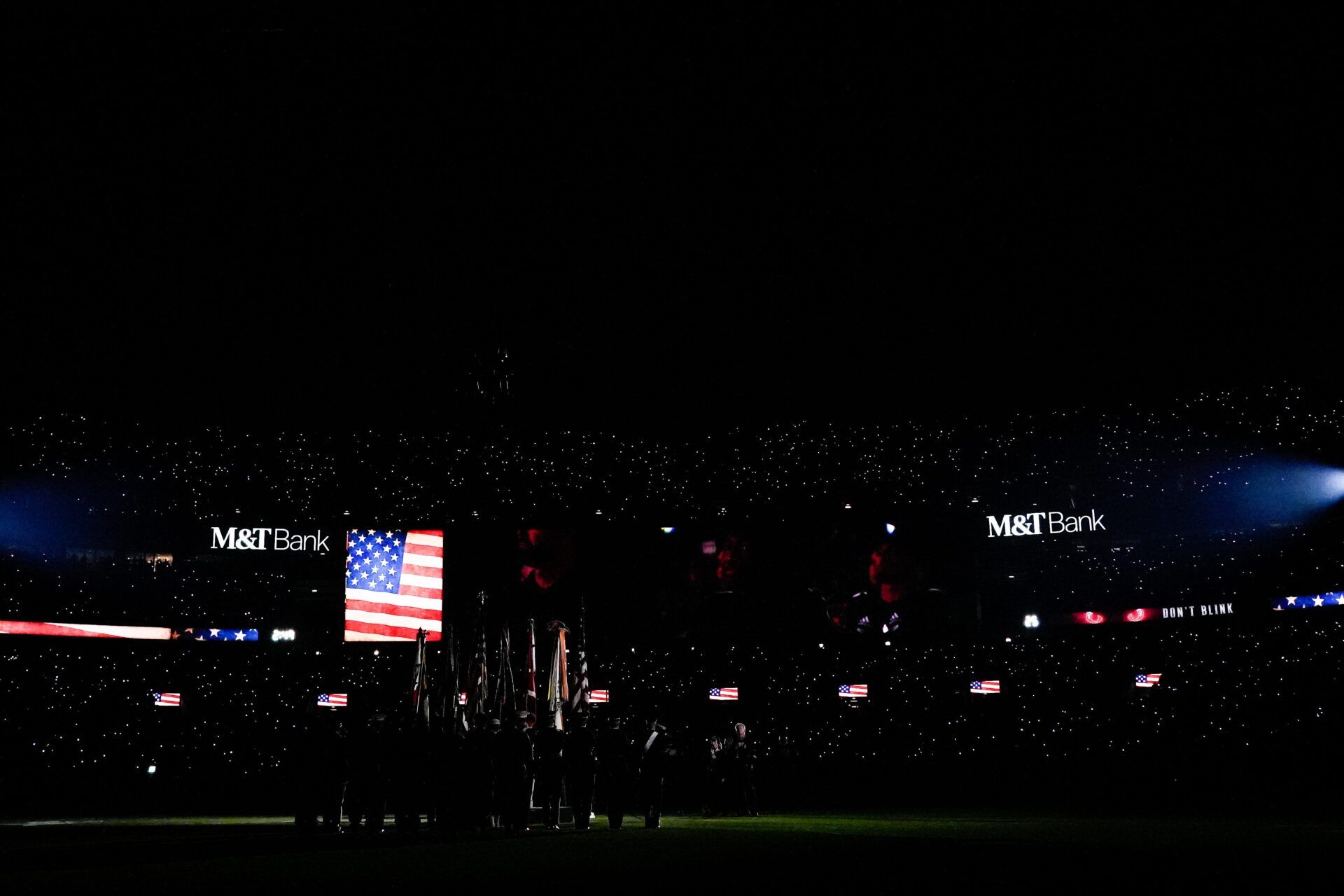 Fans cell phones light the stands during the National Anthem before the first quarter of the NFL Week 11 game between the Baltimore Ravens and the Cincinnati Bengals at M&T Bank Stadium in Baltimore on Thursday, Nov. 16, 2023.