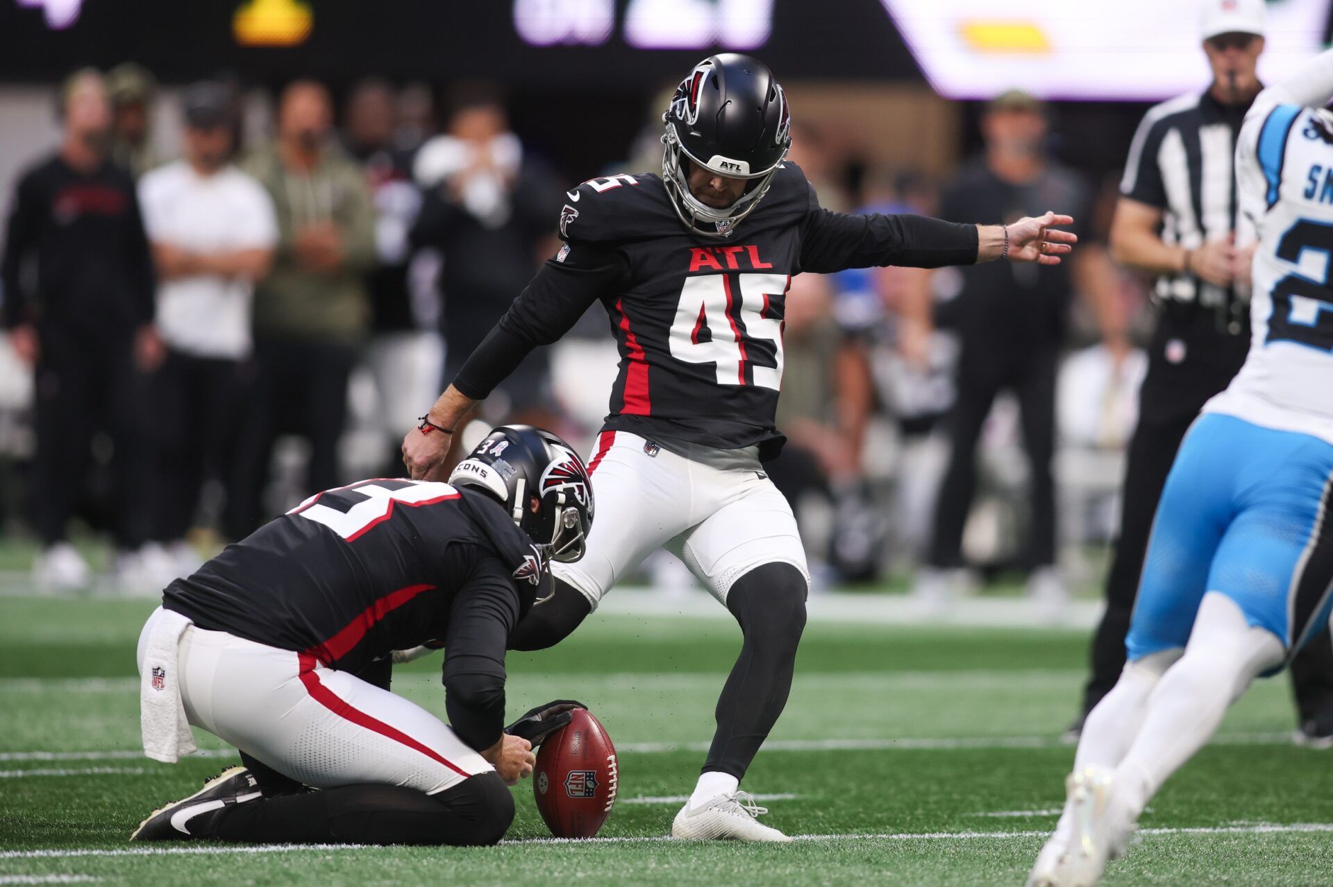 Atlanta Falcons kicker Zane Gonzalez (45) kicks a field goal to extend the game to overtime against the Carolina Panthers at Mercedes-Benz Stadium.