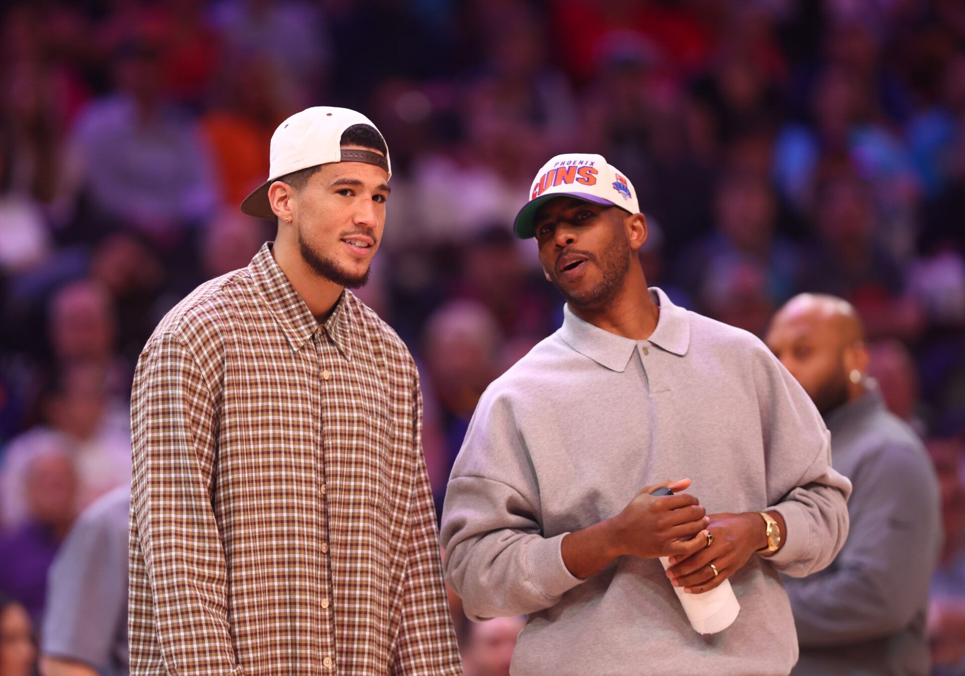Phoenix Suns guard Devin Booker (left) and Chris Paul against the Los Angeles Clippers in the second half at Footprint Center.