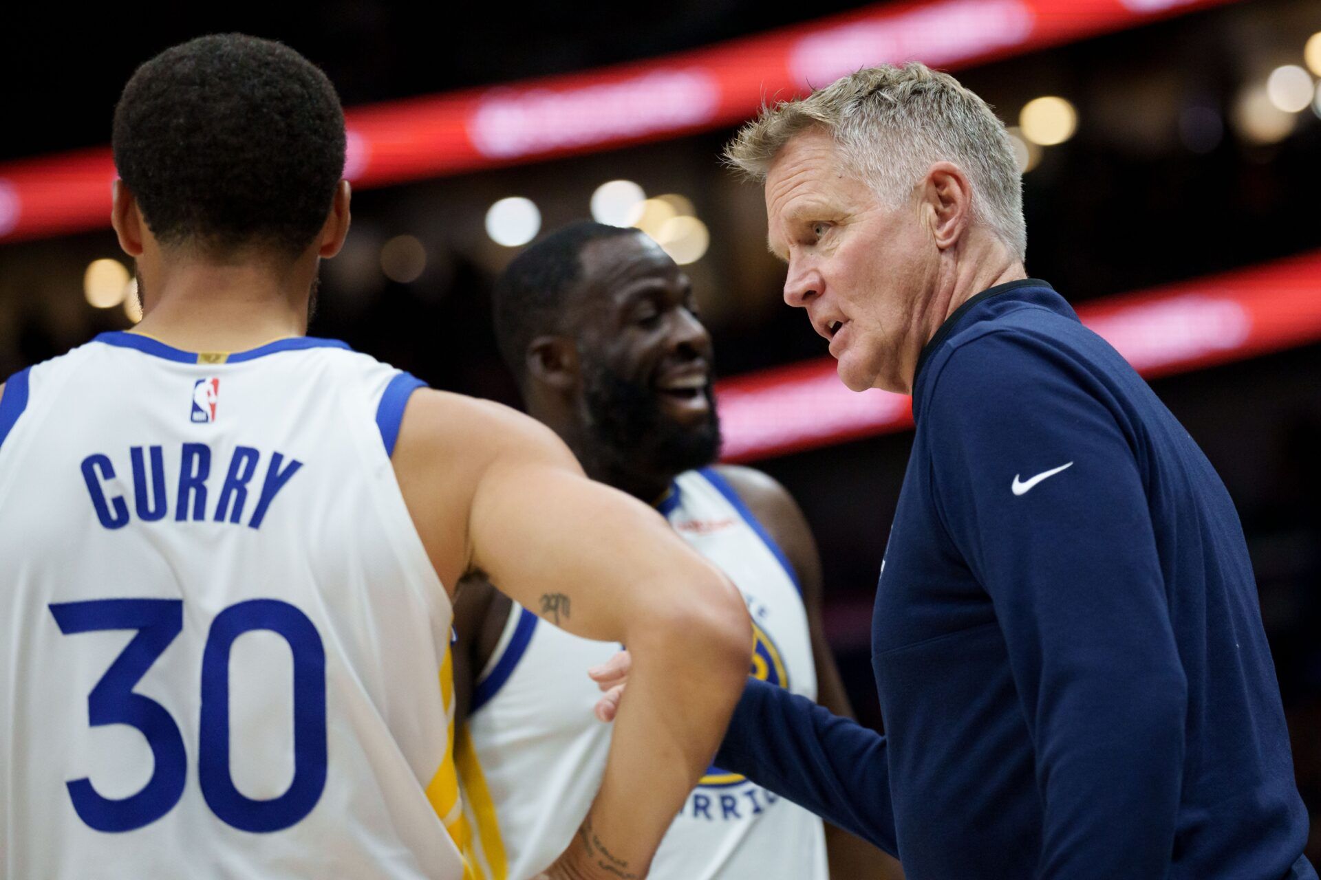 Golden State Warriors head coach Steve Kerr talks to guard Stephen Curry (30) and forward Draymond Green (23) during the first half against the New Orleans Pelicans at Smoothie King Center.