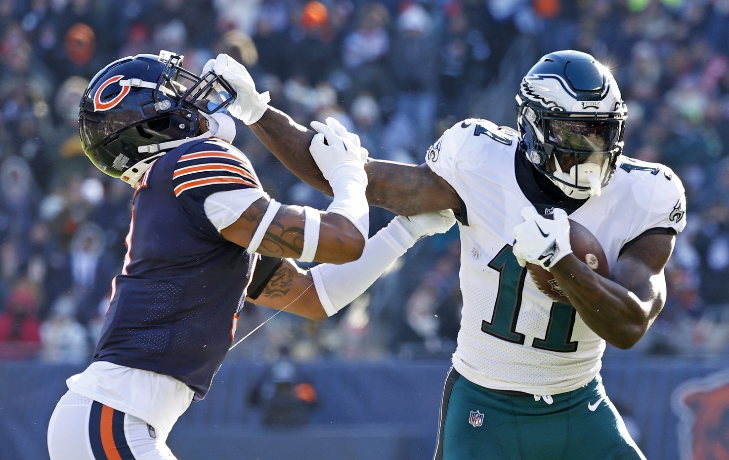 Philadelphia Eagles wide receiver A.J. Brown (11) runs the ball after a catch on Chicago Bears safety Jaquan Brisker (9) during the second quarter at Soldier Field.