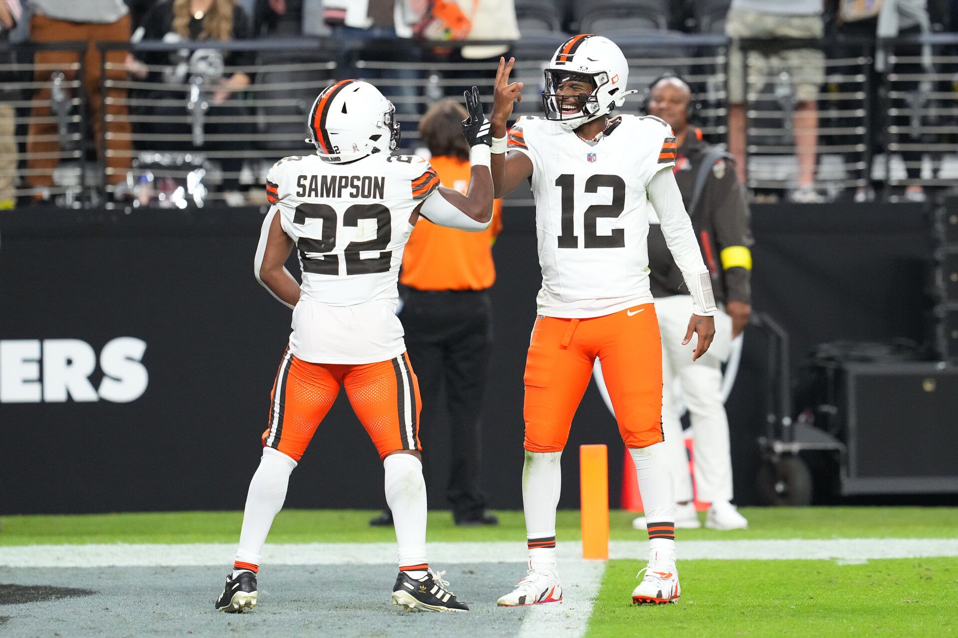 Cleveland Browns quarterback Shedeur Sanders (12) celebrates with running back Dylan Sampson (22) after the two connected for a passing touchdown against the Las Vegas Raiders during the fourth quarter at Allegiant Stadium.