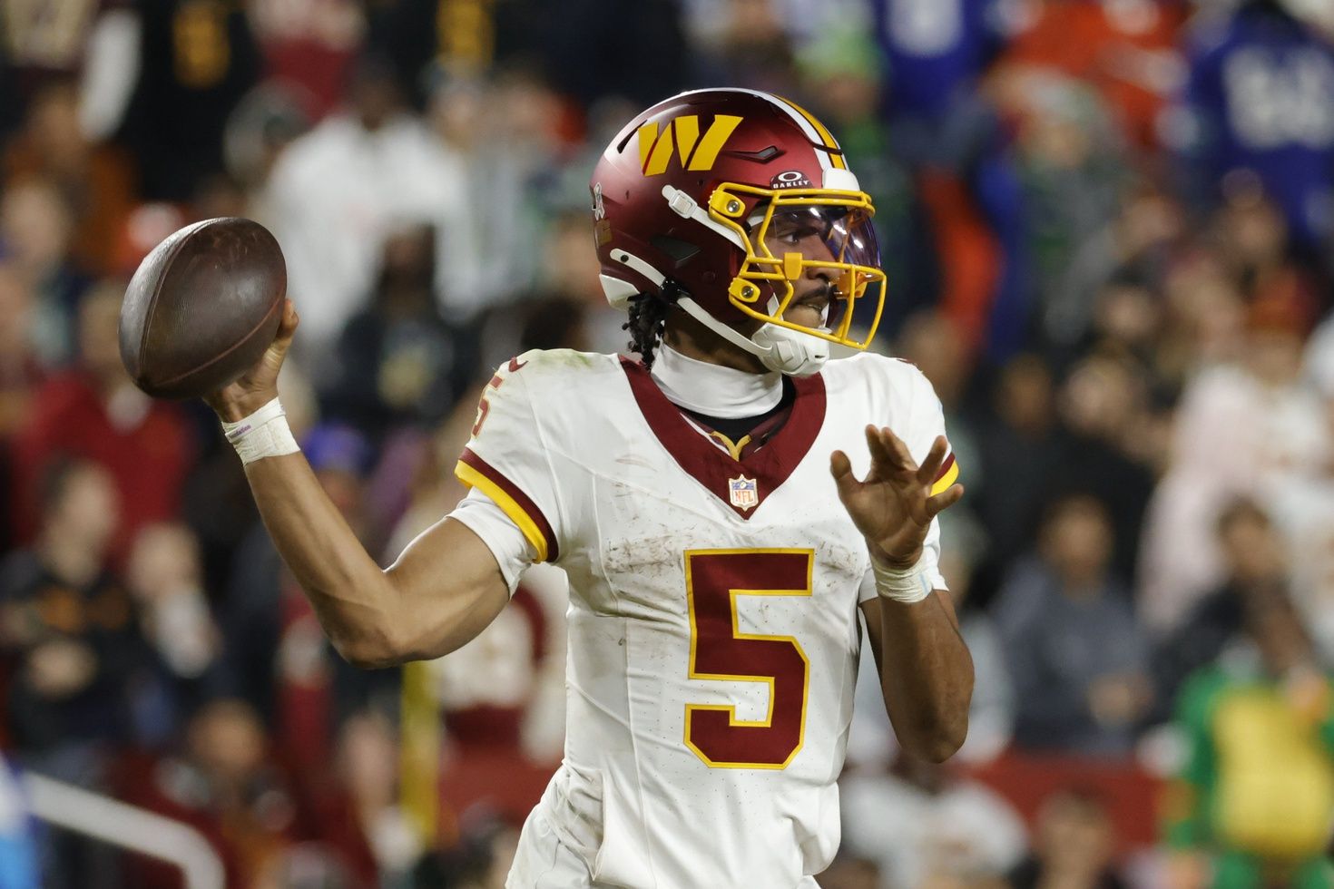 Washington Commanders quarterback Jayden Daniels (5) passes the ball during the second half against the Seattle Seahawks at Northwest Stadium.