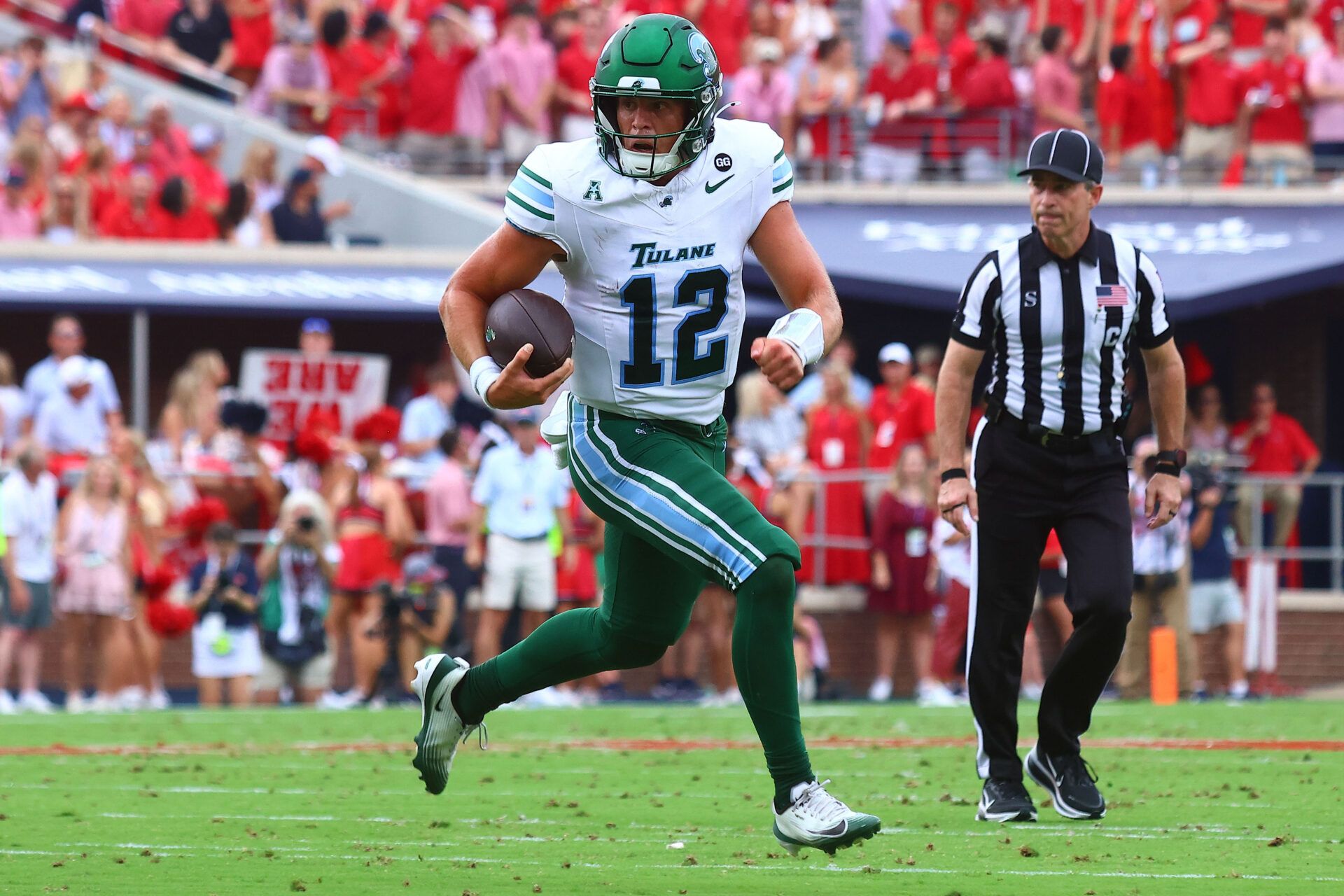 Tulane Green Wave quarterback Jake Retzlaff (12) runs the ball during the second quarter against the Mississippi Rebels at Vaught-Hemingway Stadium.