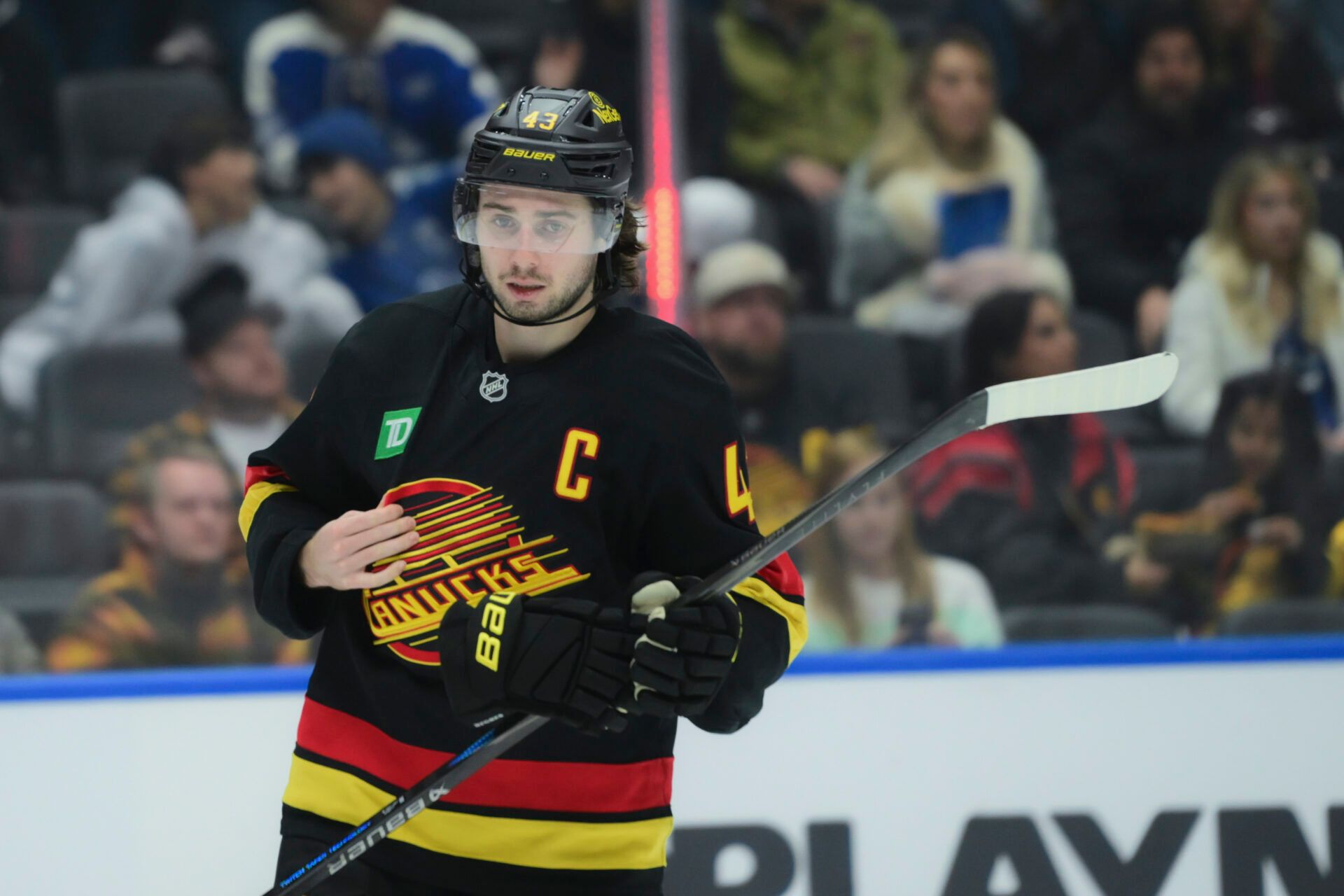 Vancouver Canucks defenseman Quinn Hughes (43) skates between play during the second period against the Calgary Flames at Rogers Arena.