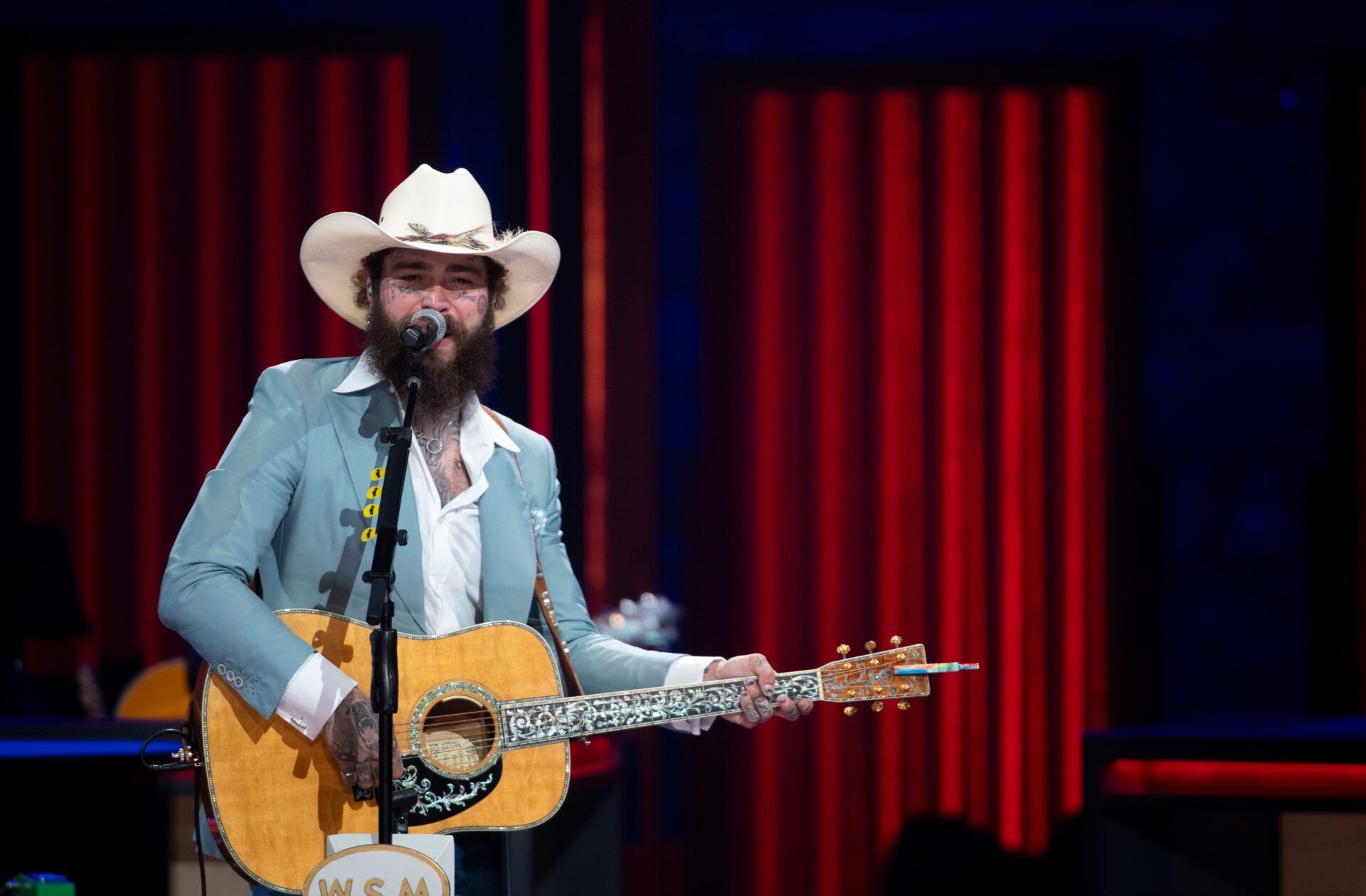 Post Malone performs at Grand Ole Opry in Nashville , Tenn., Wednesday, Aug. 14, 2024.