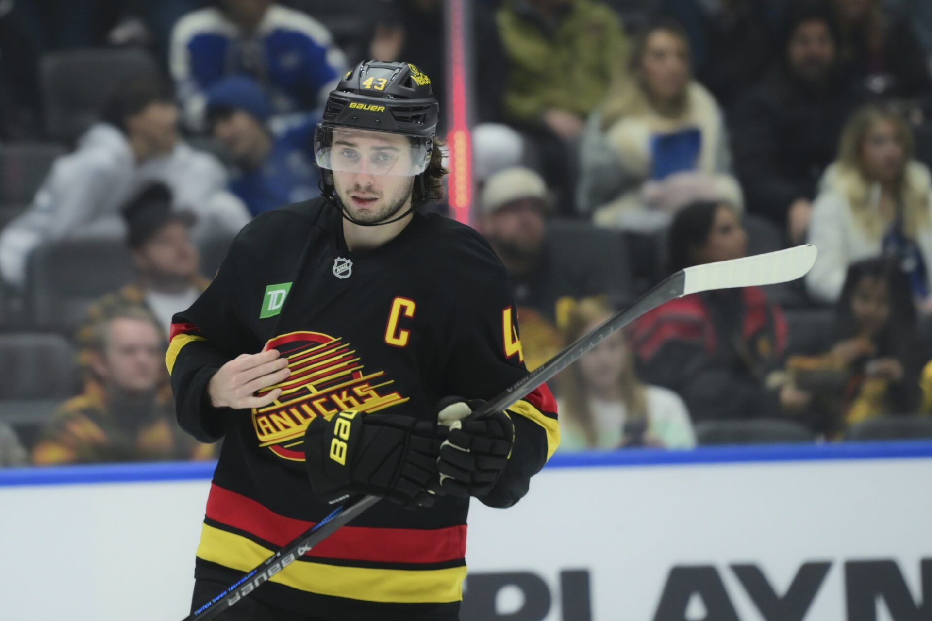 Vancouver Canucks defenseman Quinn Hughes (43) skates between play during the second period against the Calgary Flames at Rogers Arena.