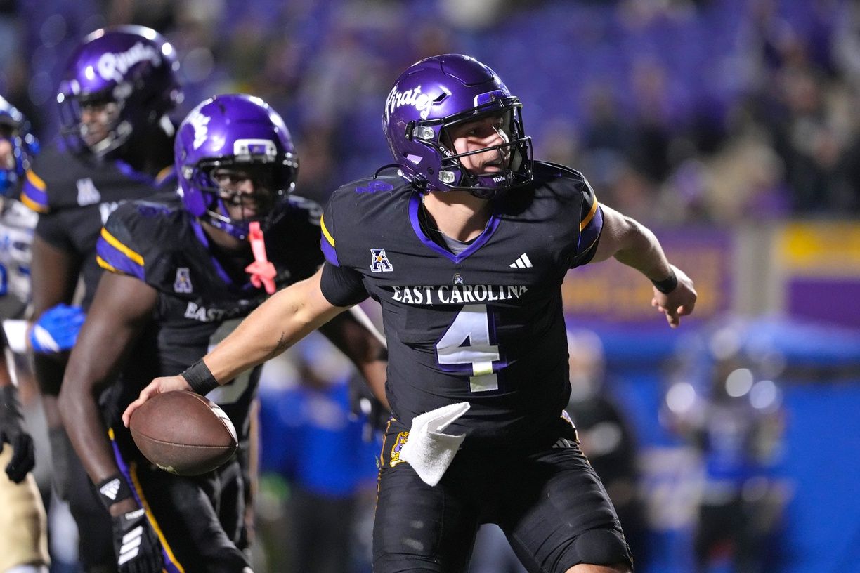 East Carolina Pirates quarterback Katin Houser (4) celebrates his touchdown run against the Tulsa Golden Hurricane during the second half at Dowdy-Ficklen Stadium.