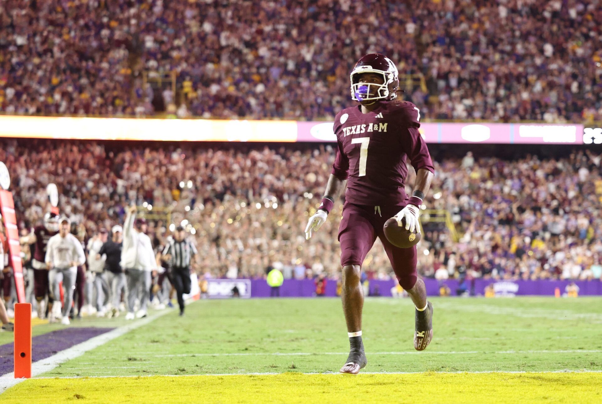 Texas A&M Aggies wide receiver KC Concepcion (7) returns a punt for a touchdown during the second half against the Louisiana State Tigers at Tiger Stadium.