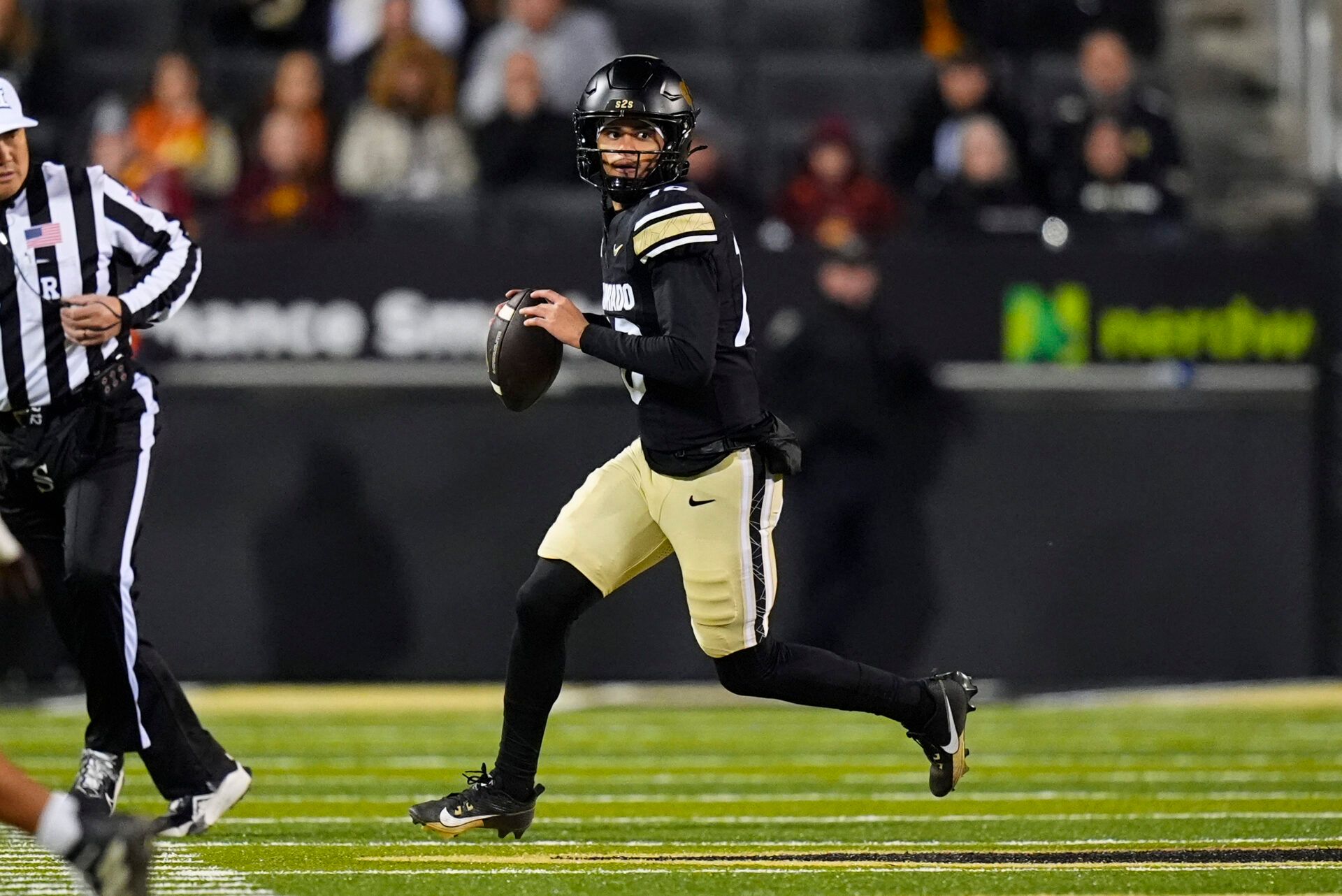 Colorado Buffaloes quarterback Julian Lewis (10) scrambles in the first quarter against the Arizona State Sun Devils at Folsom Field.