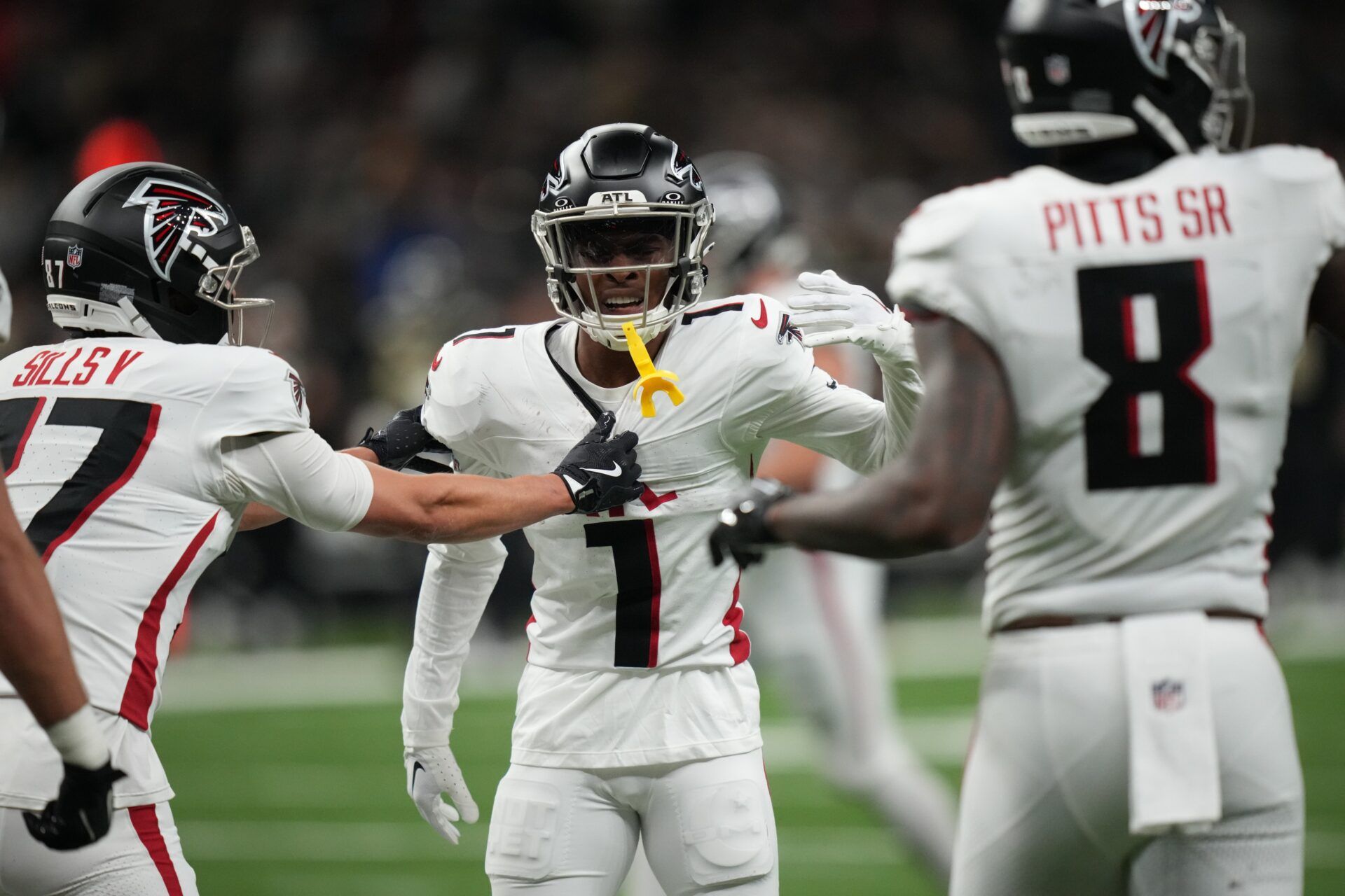 Atlanta Falcons wide receiver Darnell Mooney (1) reacts with teammates after catching a touchdown against the New Orleans Saints during the second half at Caesars Superdome.