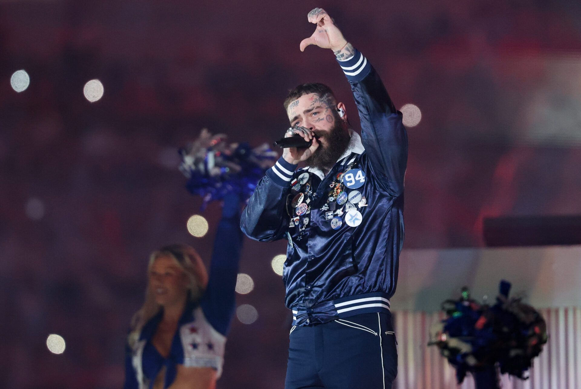 Post Malone performs during halftime of the game between the Kansas City Chiefs and Dallas Cowboys at AT&T Stadium.