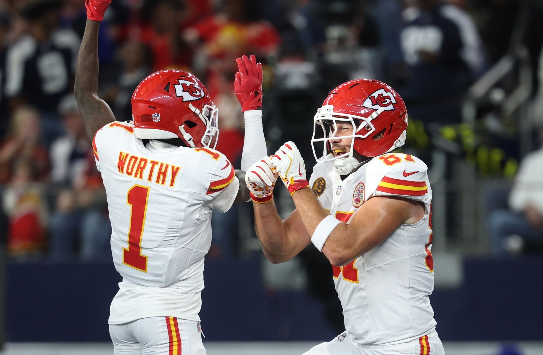 Kansas City Chiefs wide receiver Xavier Worthy (1) and Kansas City Chiefs tight end Travis Kelce (87) celebrate after a touchdown against the Dallas Cowboys during the first quarter at AT&T Stadium.