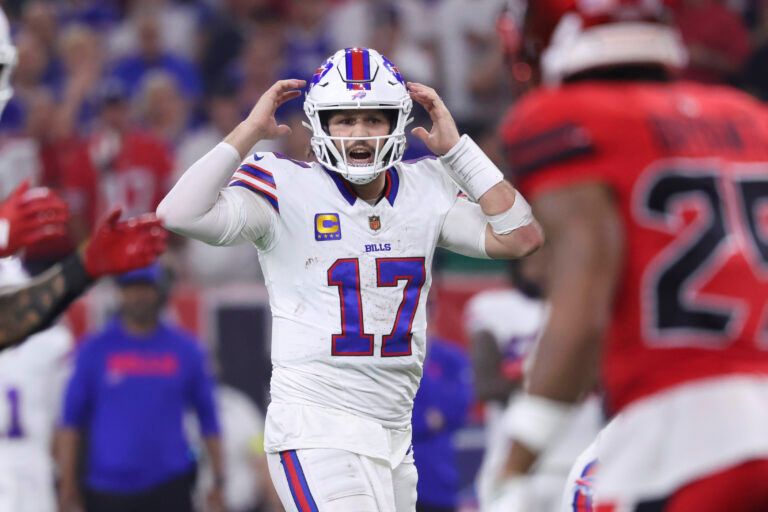 Buffalo Bills quarterback Josh Allen (17) signals at the line of scrimmage during the second half against the Houston Texans at NRG Stadium.