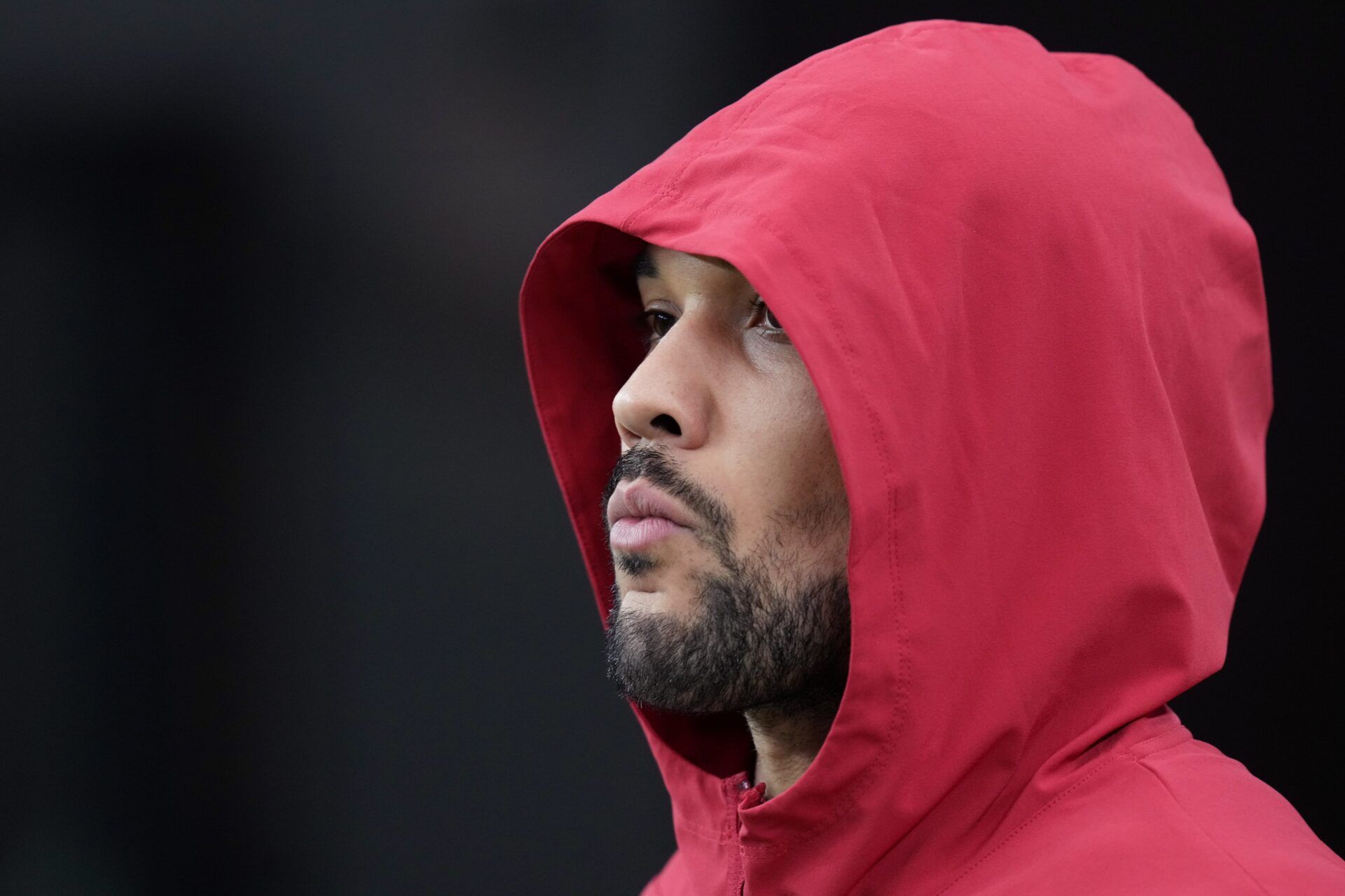 Arizona Cardinals running back James Conner watches his teammates warm up to play the Jacksonville Jaguars at State Farm Stadium on Nov. 23, 2025.