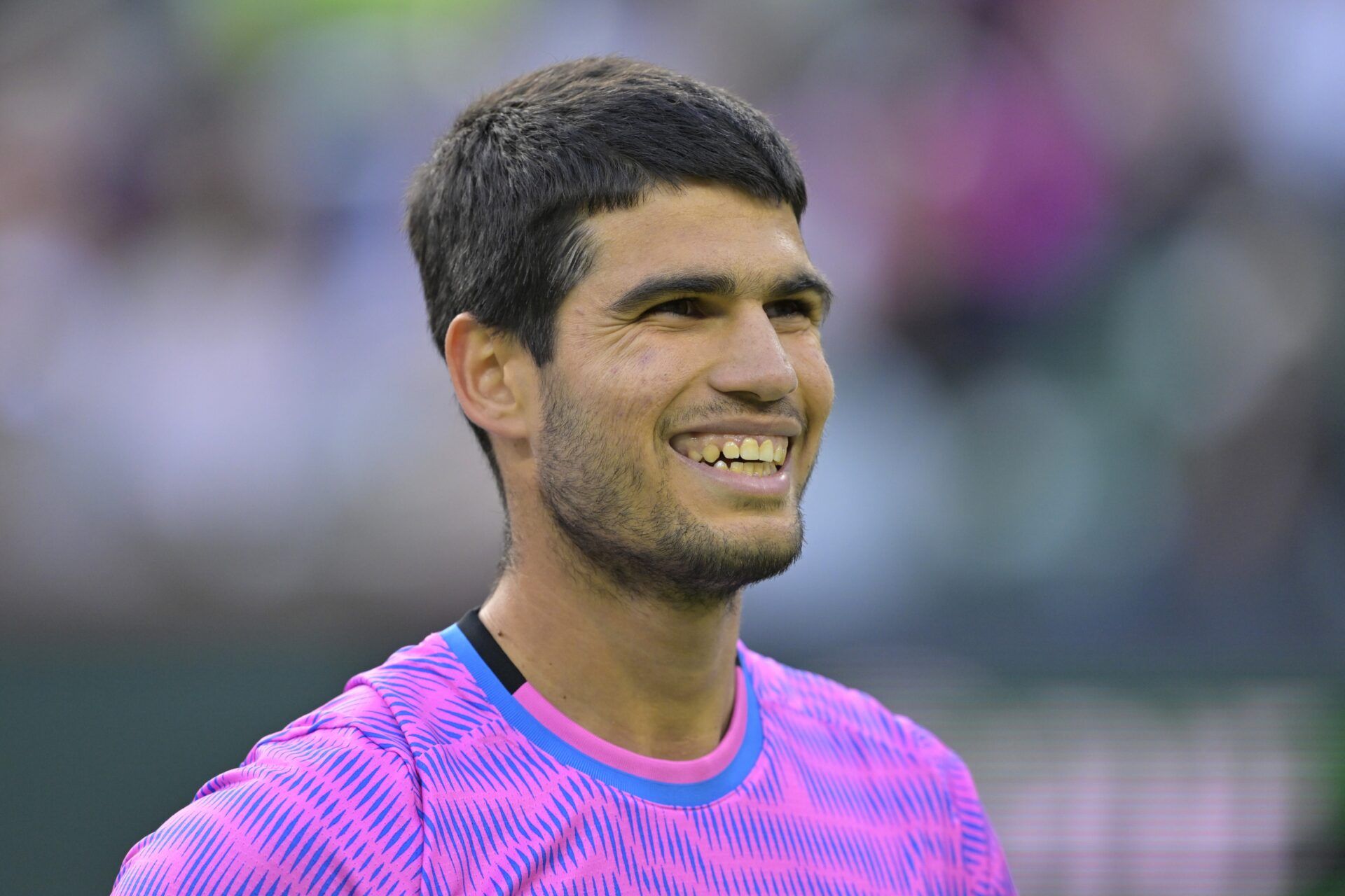 Carlos Alcaraz (ESP) smiles after winning a point in his quarterfinal match as he defeated Alexander Zverev (GER) in the BNP Paribas Open at the Indian Wells Tennis Garden.