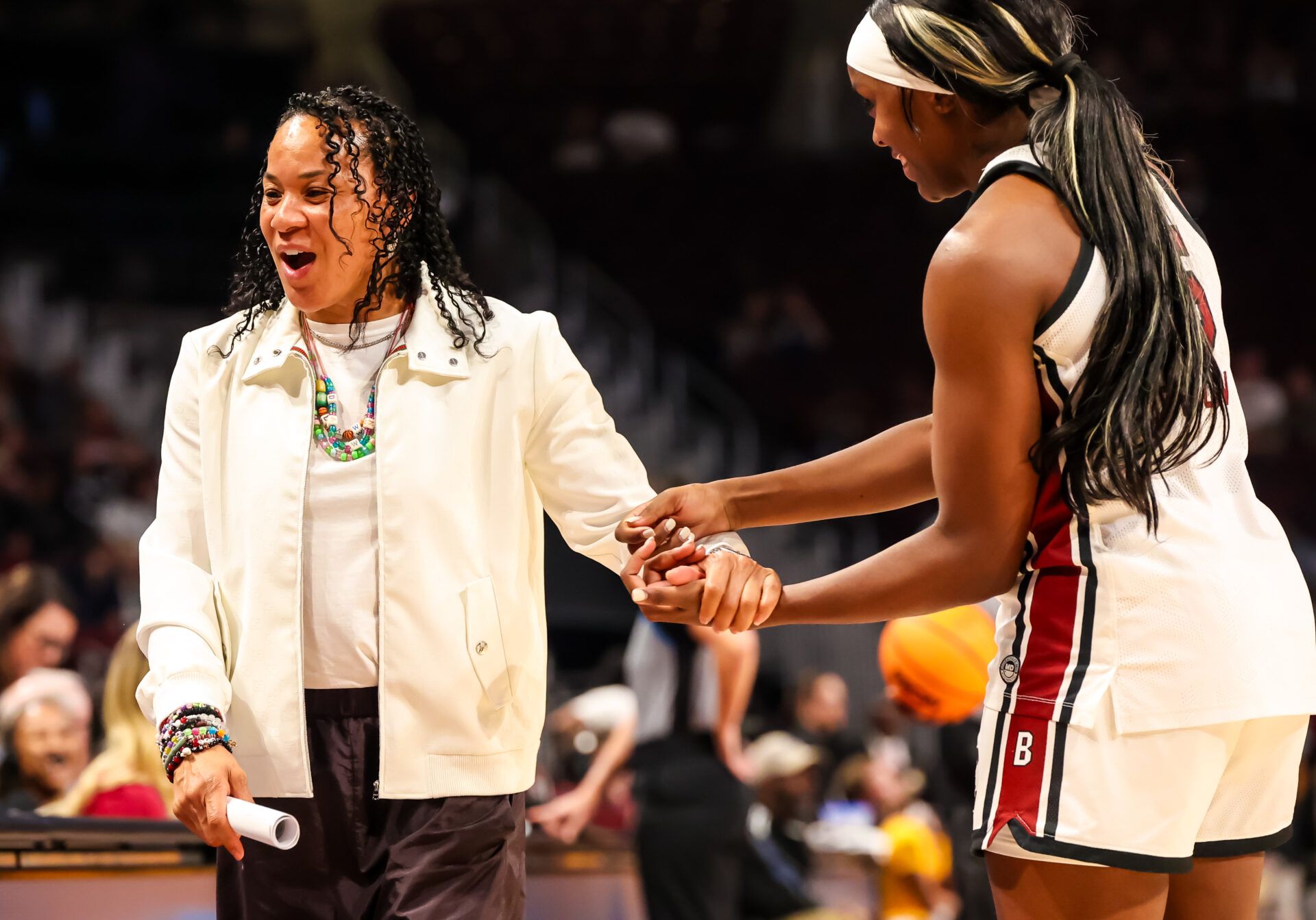South Carolina Gamecocks head coach Dawn Staley jokes with guard Raven Johnson (25) against the Winthrop Eagles in the second half at Colonial Life Arena.