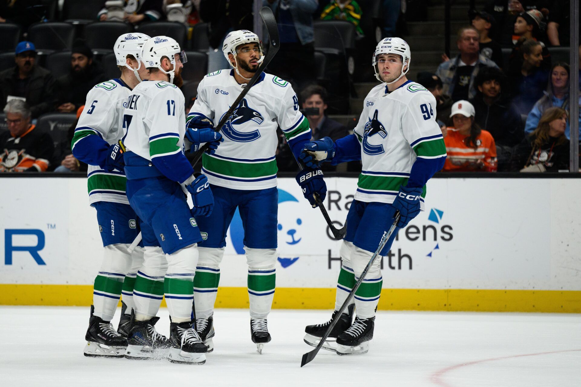 Vancouver Canucks left wing Evander Kane (91) celebrates with  teammates after scoring a goal during the first period against the Anaheim Ducks at Honda Center.