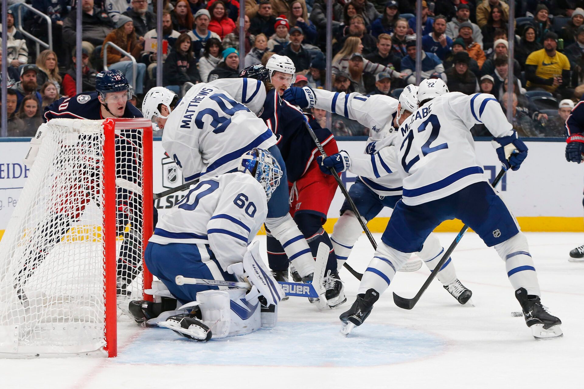 Toronto Maple Leafs goalie Joseph Woll (60) makes a save on the shot attempt of Columbus Blue Jackets left wing Dmitri Voronkov (10) during the second period at Nationwide Arena.