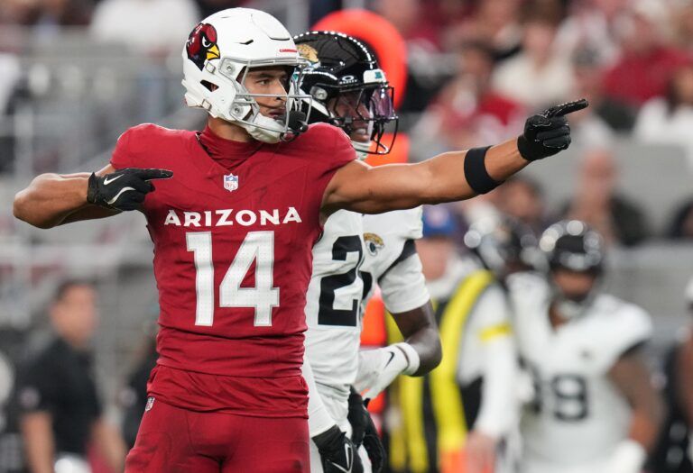 Arizona Cardinals receiver Michael Wilson (14) signals a first down after his catch against the Jacksonville Jaguars at State Farm Stadium on Nov. 23, 2025.