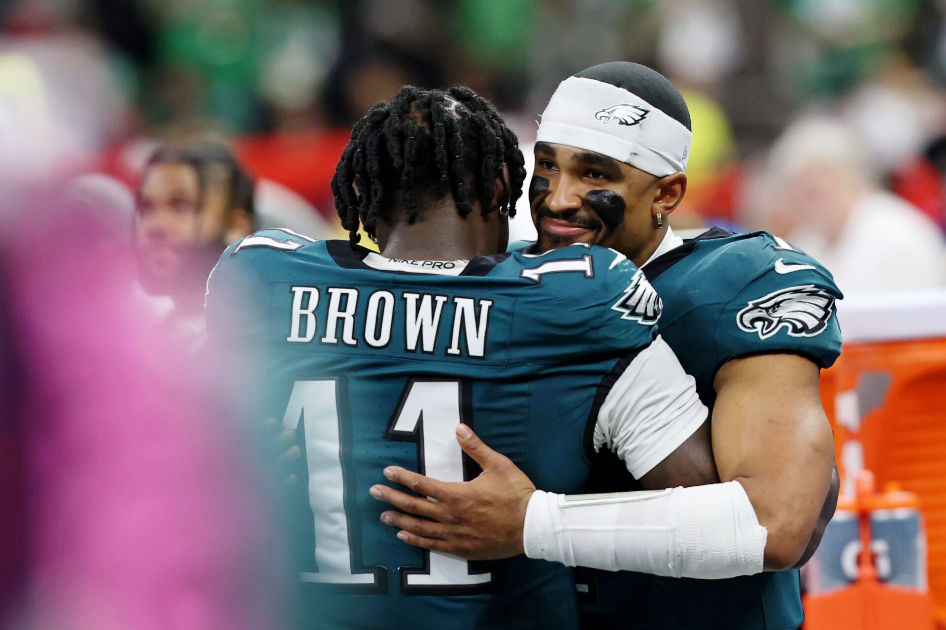 Philadelphia Eagles wide receiver A.J. Brown (11) hugs quarterback Jalen Hurts (1) during the second half of Super Bowl LIX at Caesars Superdome.