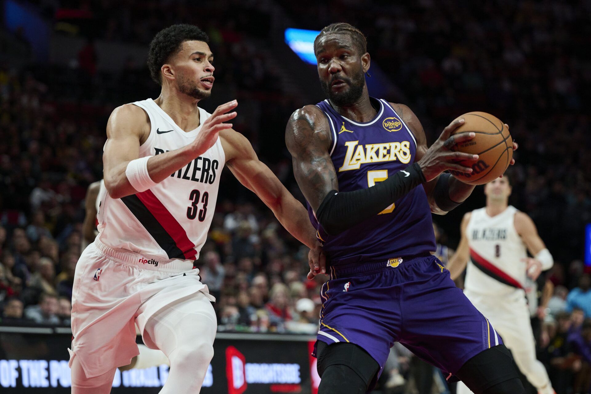 Los Angeles Lakers center Deandre Ayton (5) drives to the basket during the second half against Portland Trail Blazers forward Toumani Camara (33) at Moda Center.