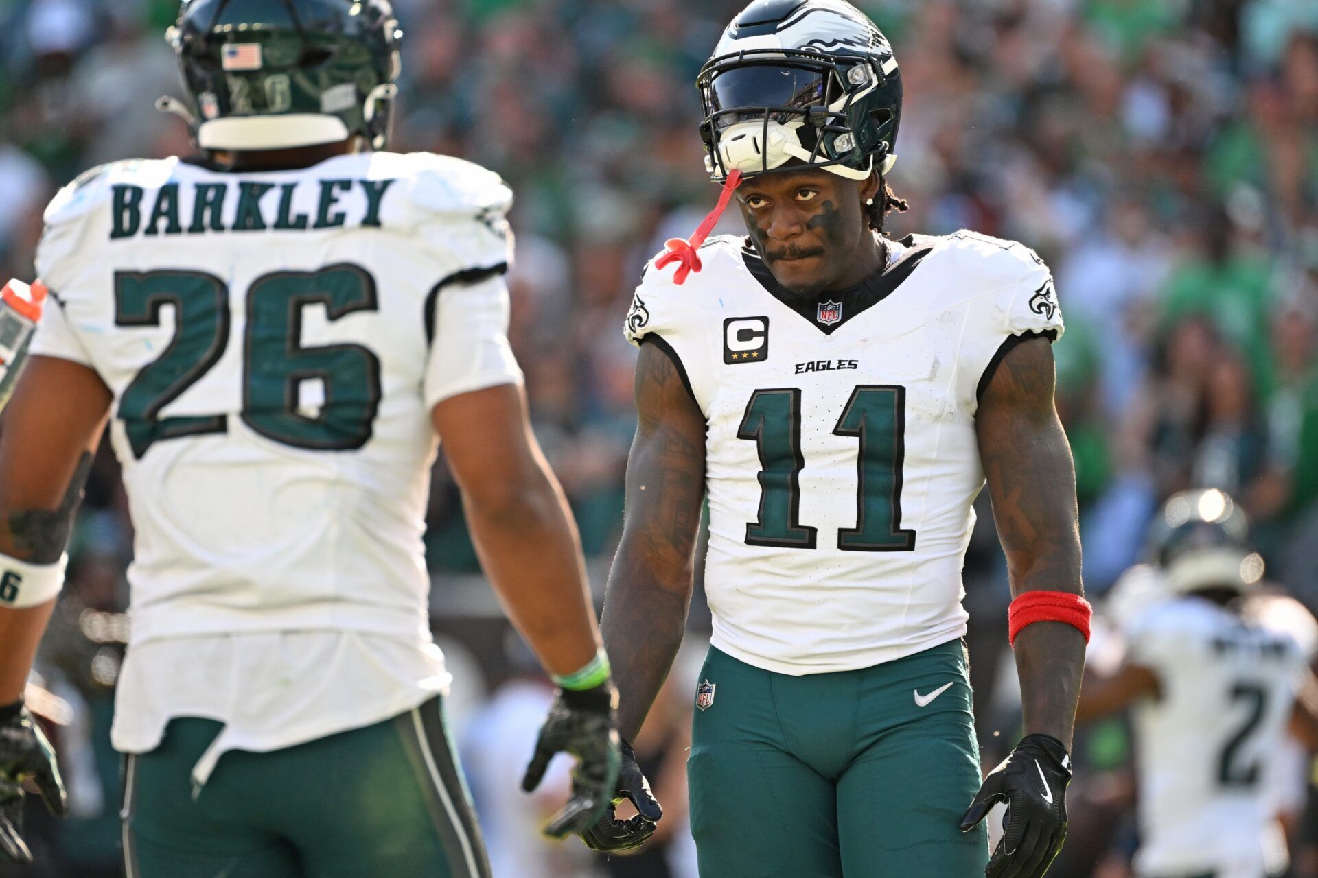 Philadelphia Eagles wide receiver AJ. Brown (11) and running back Saquon Barkley (26) during the fourth quarter against the Los Angeles Rams at Lincoln Financial Field.