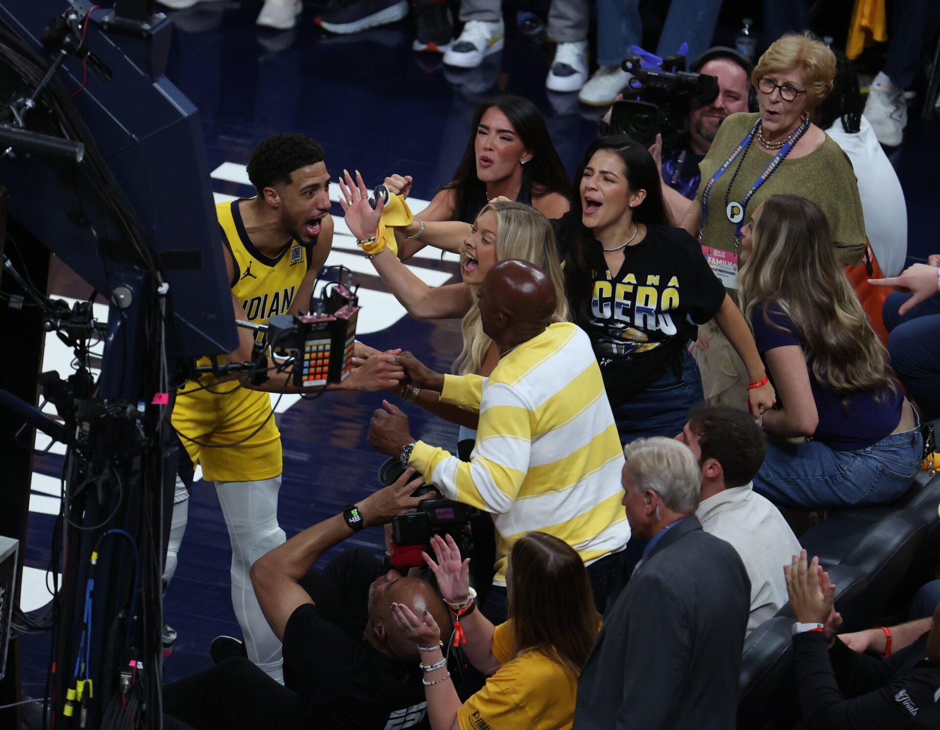 Indiana Pacers guard Tyrese Haliburton (0) reacts with his girlfriend Jade Jones and father John Haliburton following the second quarter against the Oklahoma City Thunder in game four of the 2025 NBA Finals at Gainbridge Fieldhouse.