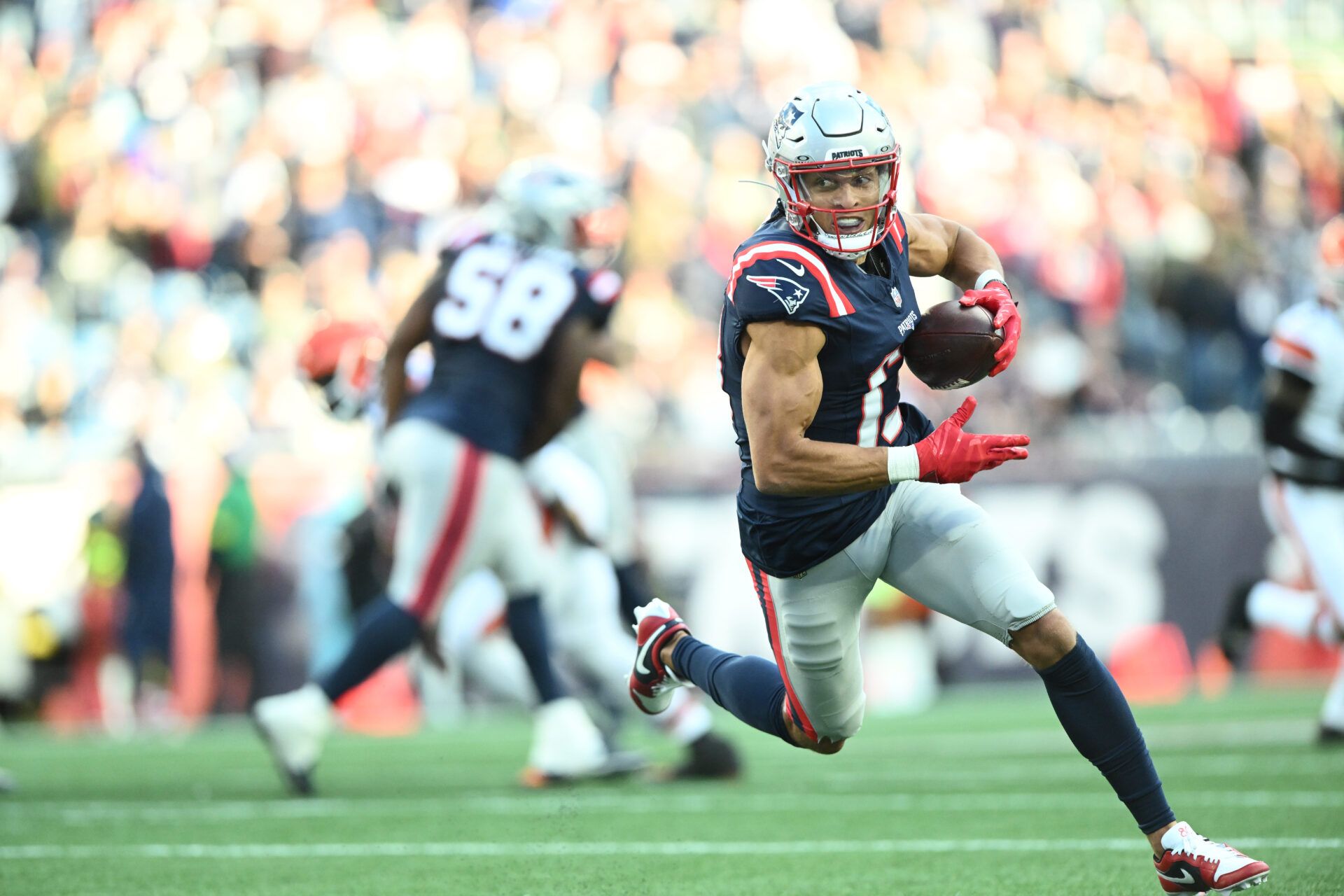 New England Patriots wide receiver Mack Hollins (13) runs with the ball during the fourth quarter against the Cleveland Browns at Gillette Stadium.