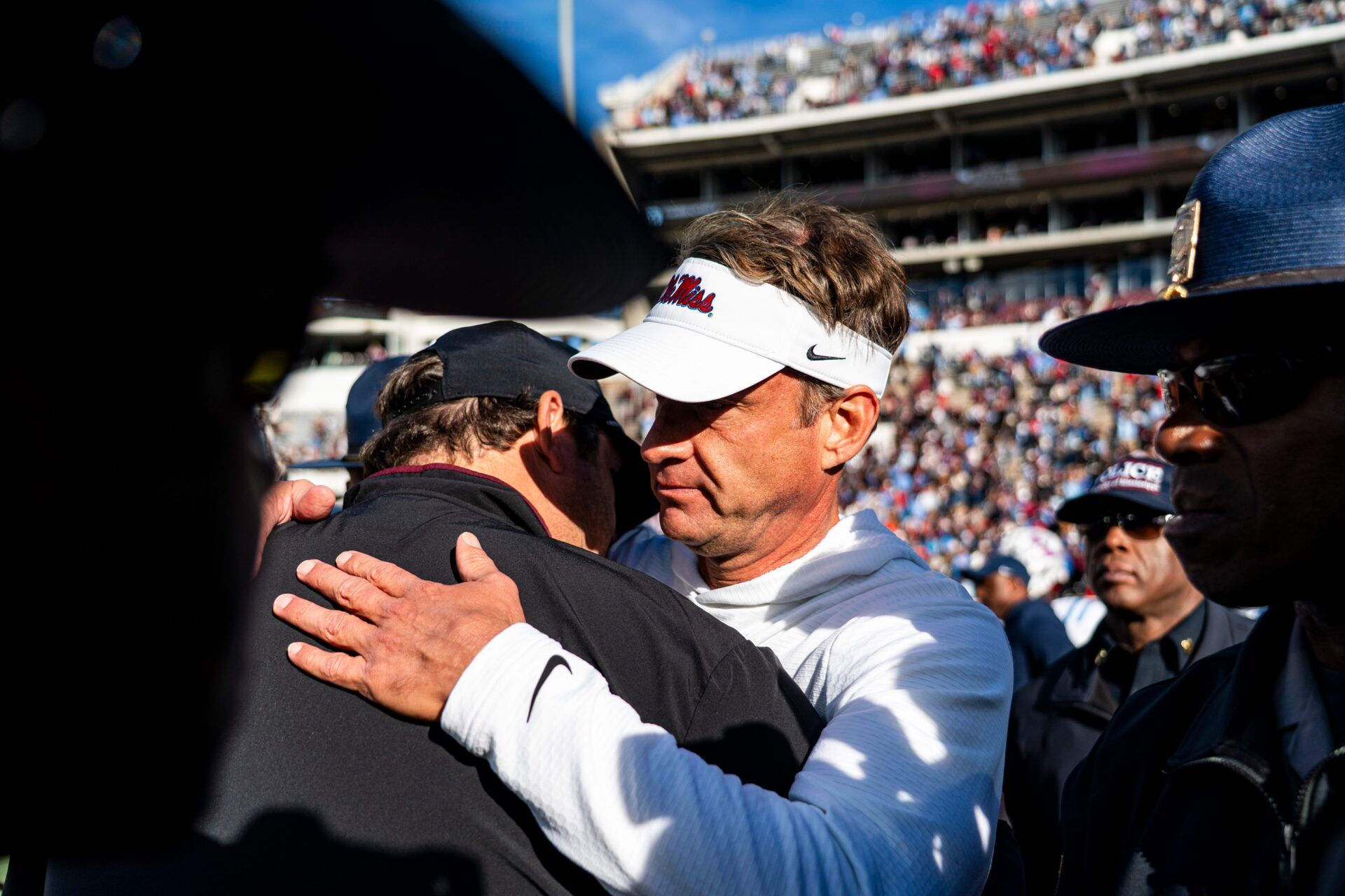 Mississippi State head coach Jeff Lebby and Ole Miss head coach Lane Kiffin shake hands after a college football game between Mississippi State and Ole Miss at Davis Wade Stadium in Starkville, Miss., on Friday, Nov. 28, 2025. Ole Miss defeated Mississippi State 38-19 in the Egg Bowl.
