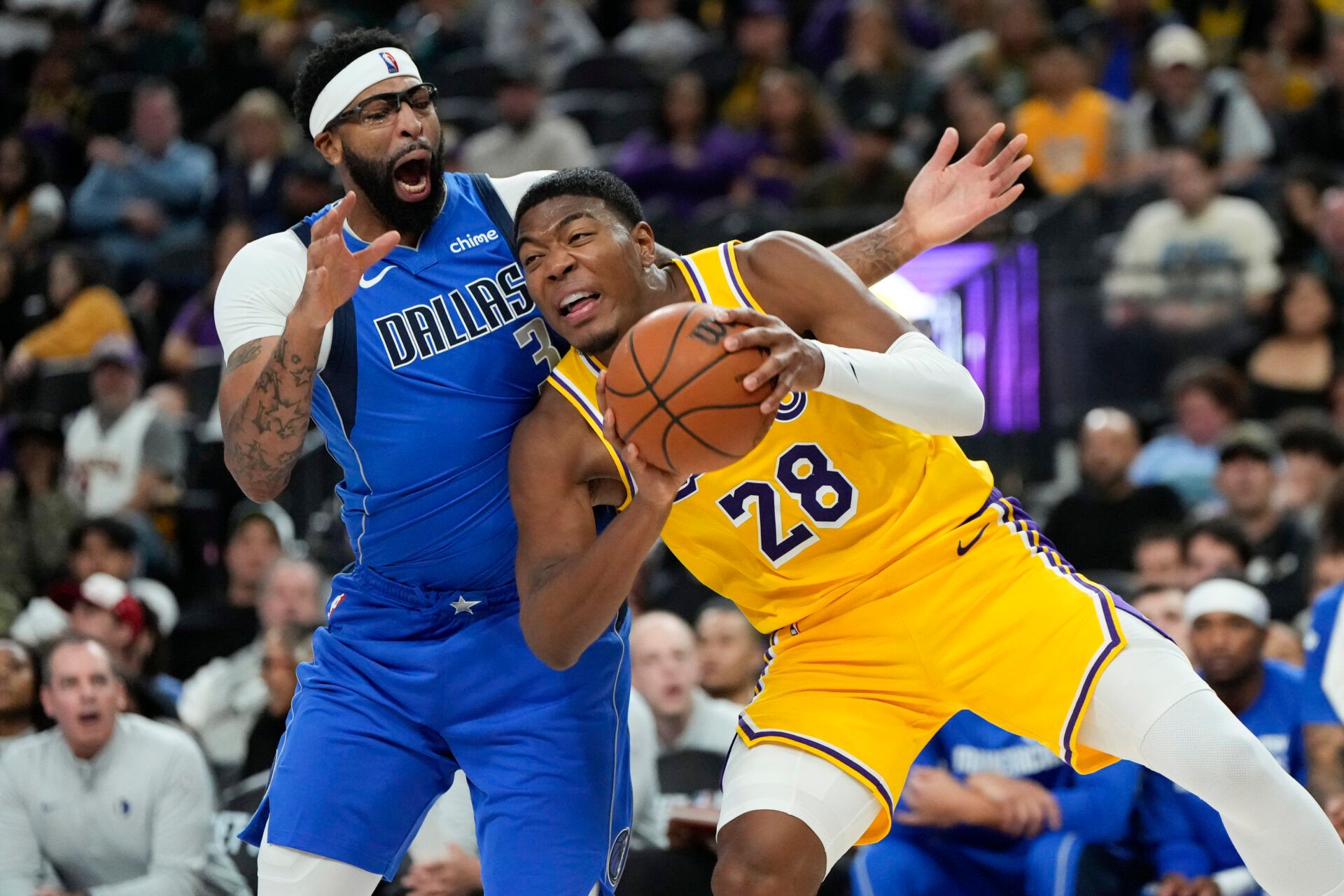 Los Angeles Lakers forward Rui Hachimura (28) drives the ball against Dallas Mavericks forward Anthony Davis (3) during the second half at T-Mobile Arena.